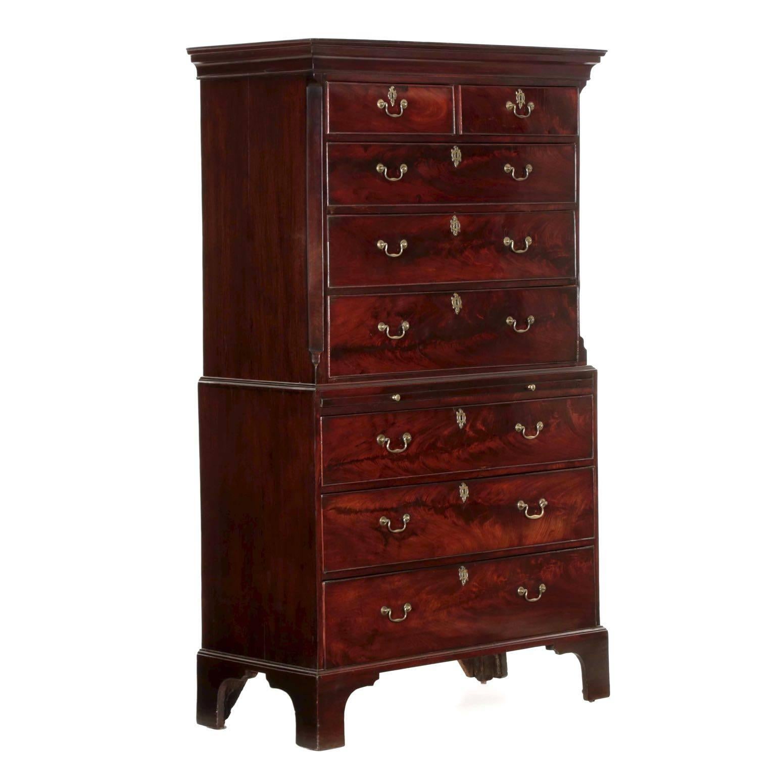 This excellent example of English craftsmanship is noteworthy for its’ use of crotch-grain mahogany throughout the front of the case. The cut is magnificent and shows the eye of an artist, as each veneer was cut to create as much drama as the branch