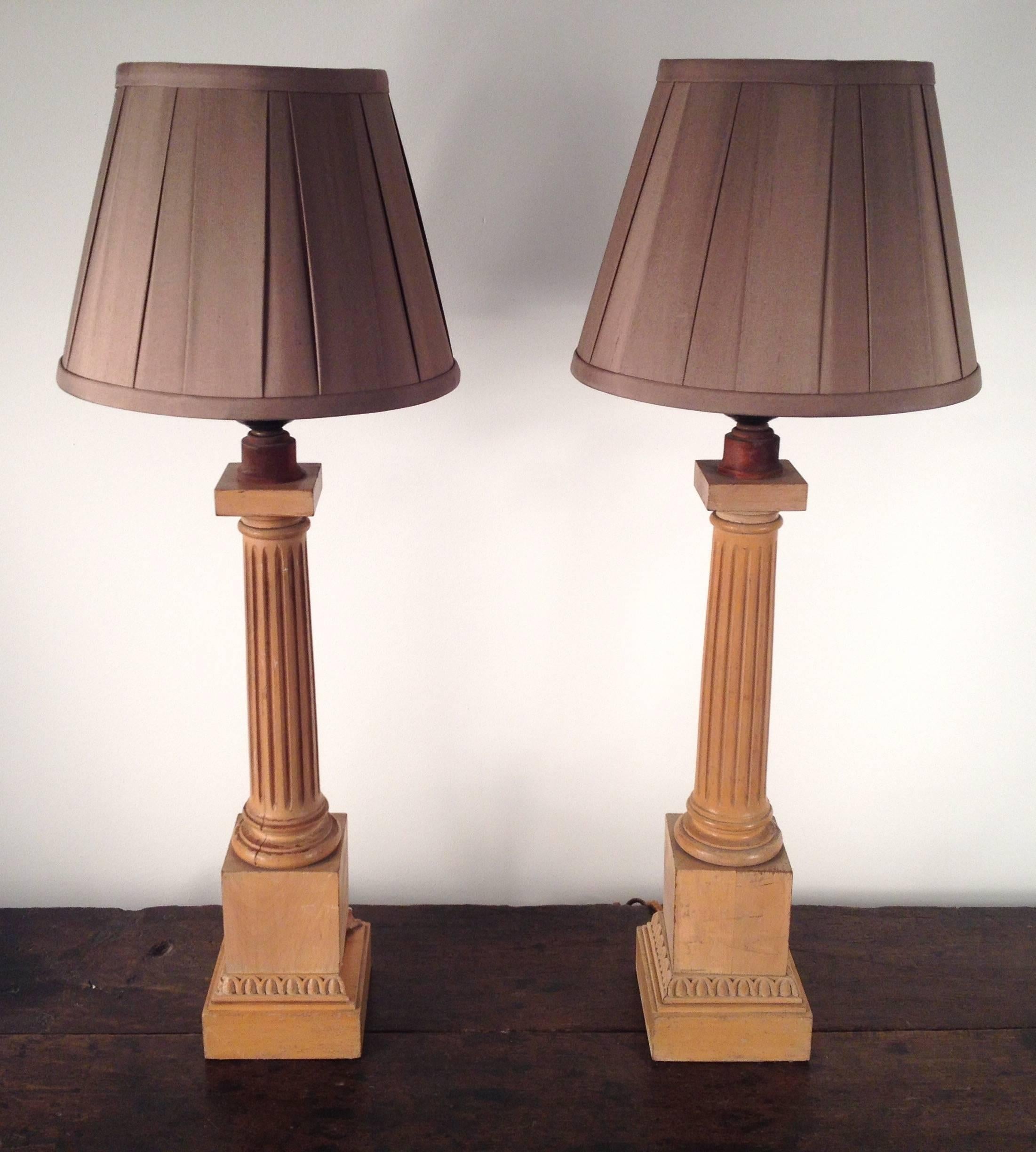 Pair of wood fluted column lamps, original brass hardware, porcelain mogul sockets. Lamps are 24