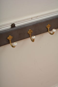A Long Antique Brass and Painted Coat Hooks, Ceramic Decorative