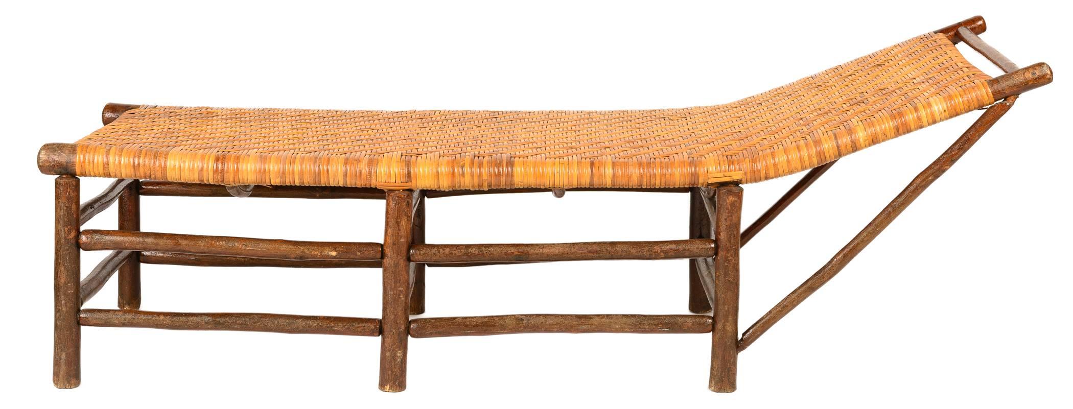 The Hickory chaise has an intricately woven cane seat and bold legs and stretchers. The construction is very sturdy and comfortable. It is a very appealing piece for a beach cottage or rustic cabin.
