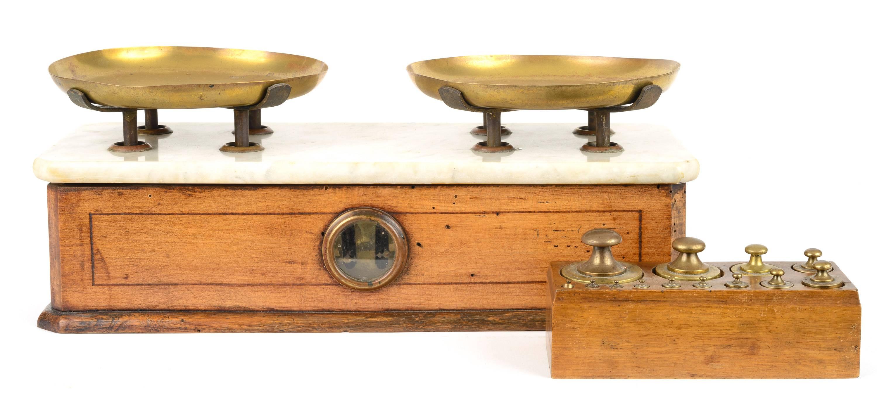 Cherrywood, marble and brass French scale with inlaid detail. It has a full set of eight calibrated weights up to 1 KG. This is the type of balance you would find in butcher or produce shop.