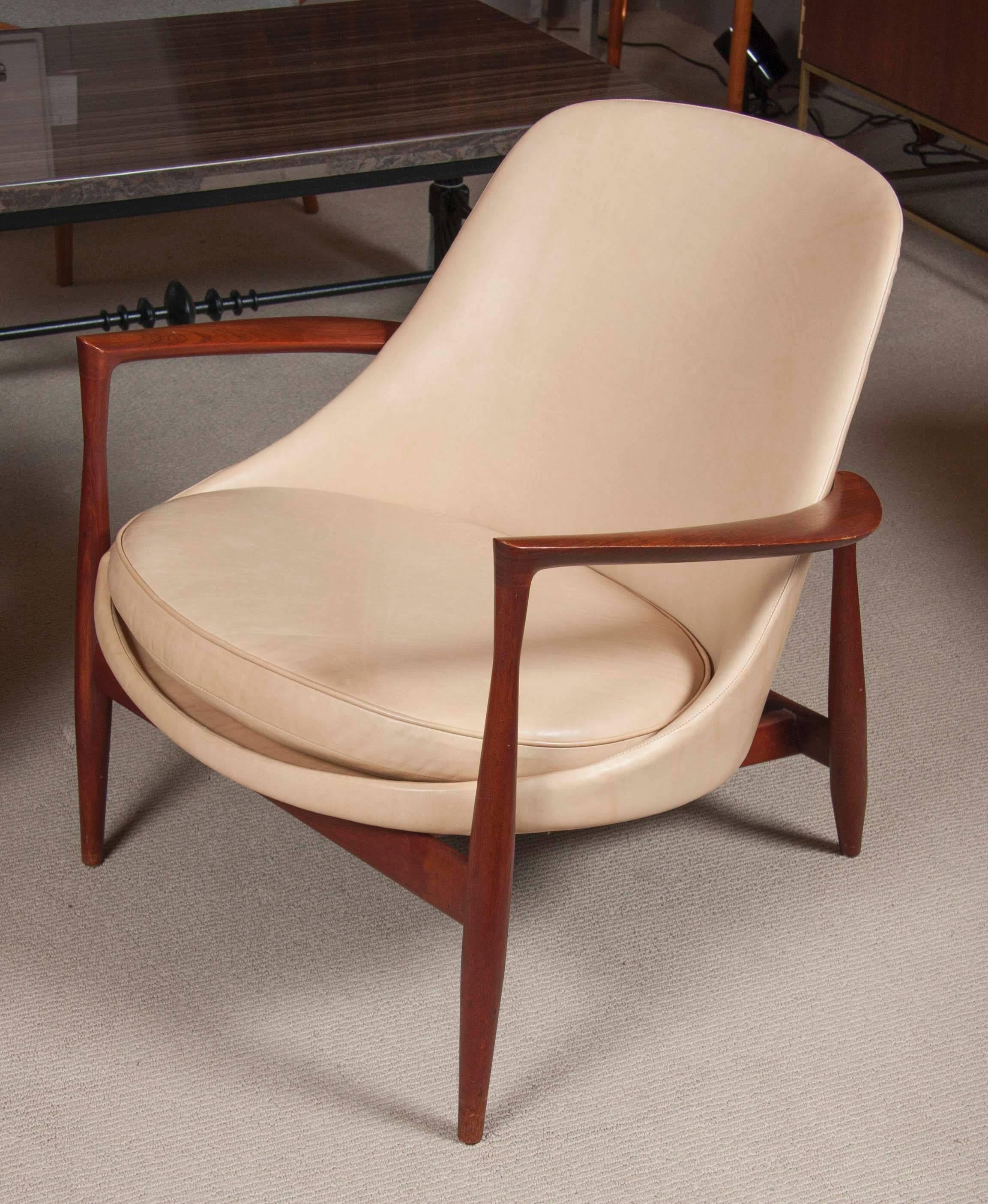 The iconic "Elizabeth" chair by Ib Kofod-Larsen, designed in 1956 and produced by Christensen & Larsen, Denmark. Frame is in teak and seat is newly upholstered in buttery soft leather.