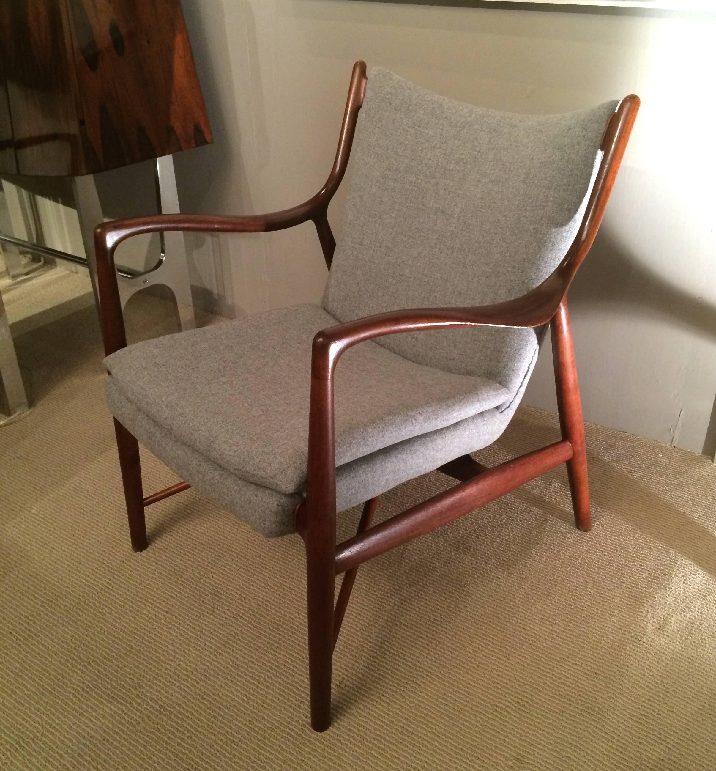 Offered for your consideration is an icon of Mid-Century Danish modern design: The Finn Juhl model 45 chair for Niels Vodder. 

The revolutionary design of the chair was the first to separate the wooden frame from the upholstered seat. The