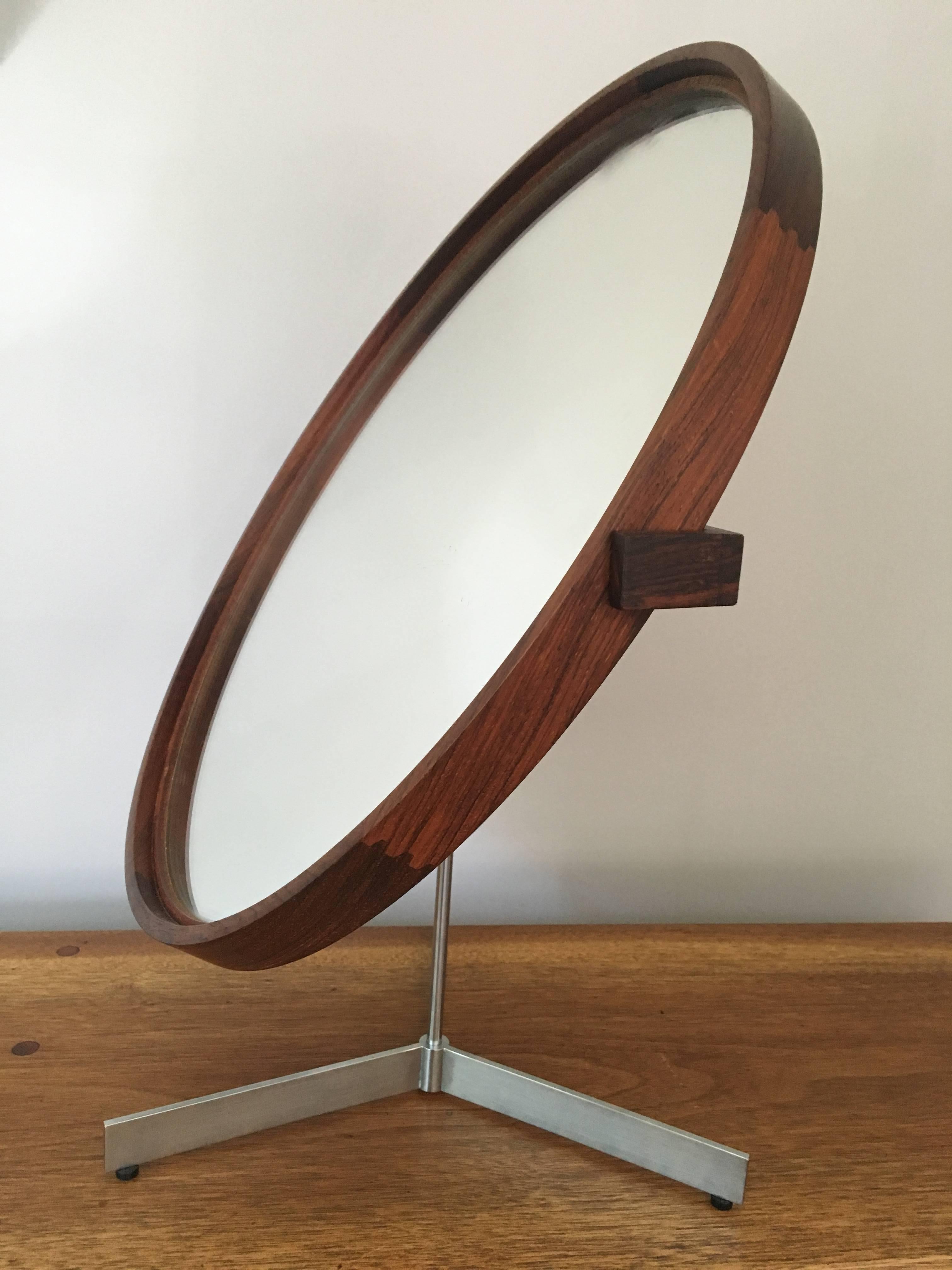 Rosewood table mirror designed by Otto and Uno Kristiansson in 1958, executed circa 1965 by Luxus Vittsjo, Sweden. Exceptional rosewood grain.