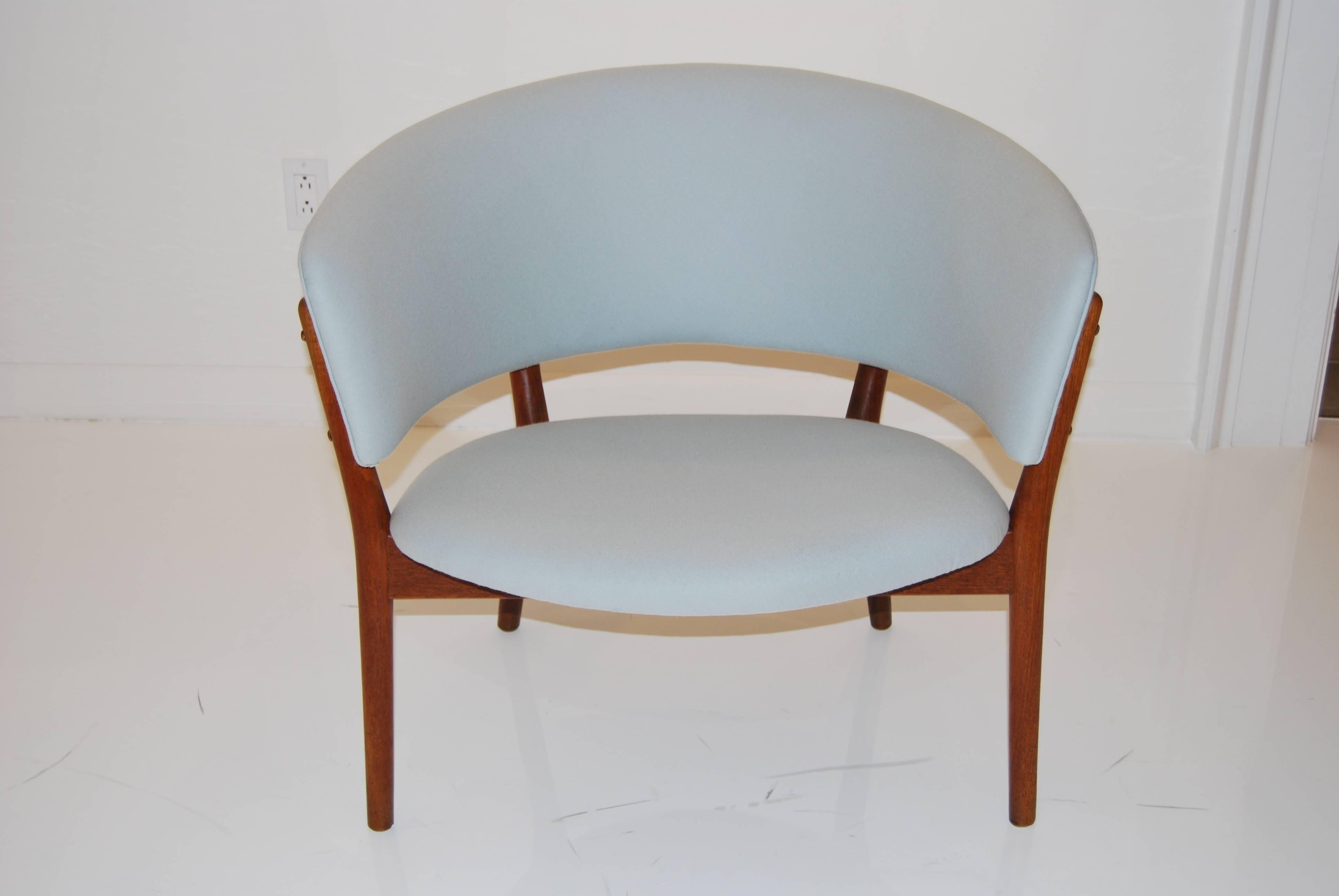 Original tub chair, designed by Nanna Ditzel in 1952 and produced by Soren Willadsen. Teak frame has been beautifully refinished, seat and back have been reupholstered in light blue wool.