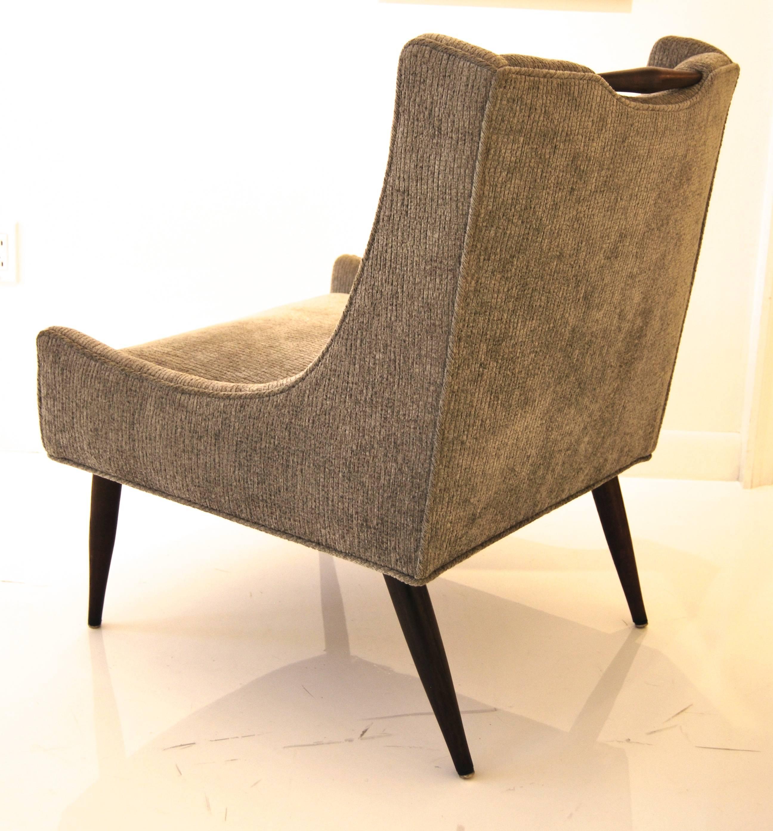 Elegant pair of slipper chairs by Harvey Probber, upholstered in charcoal grey chenille with exposed walnut handle.