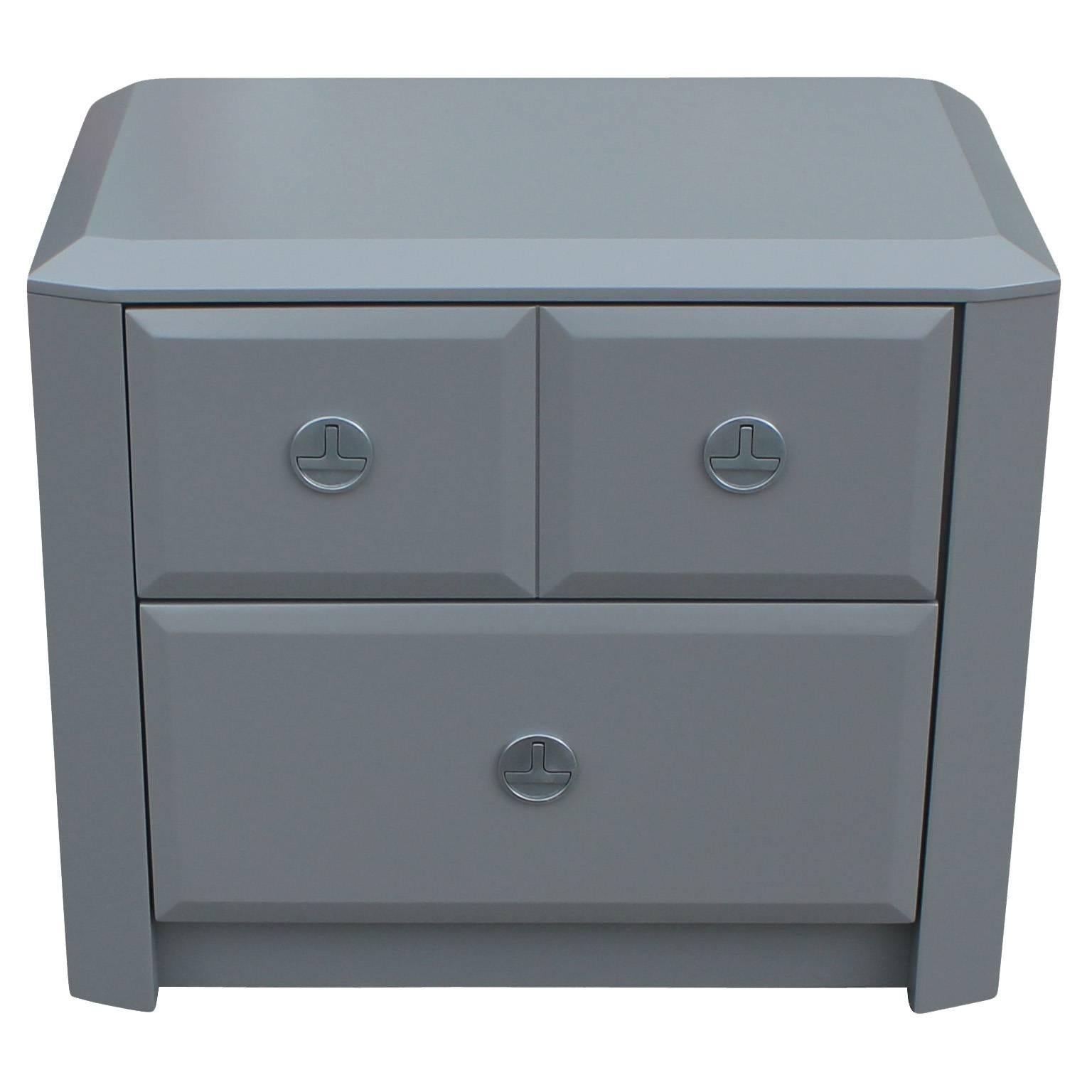 Excellent pair of grey lacquered nightstands. Gem cut or beveled details add interest to the piece. Round, brushed nickel Campaign style hardware. Two drawers provide excellent storage.
