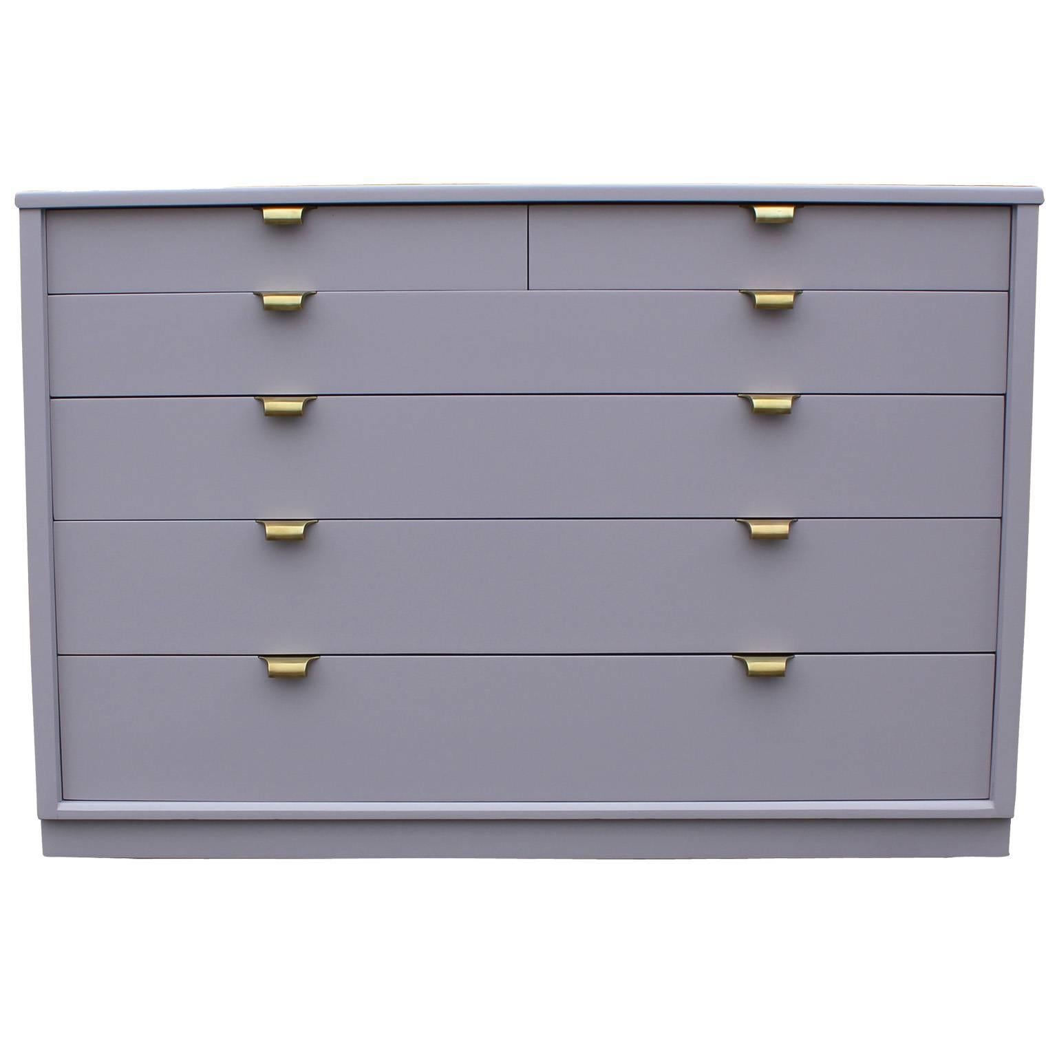 Wonderful Edward Wormley dresser from the Precedent series for Drexel. Expertly restored in a beautiful muted lavender lacquer which nicely contrasts the brass hardware. Stunning Piece in any space.