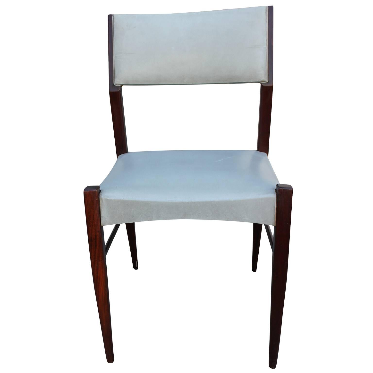 Excellent set of six clean lined, Italian dining chairs. Angular frames are finished in a dark, almost ebony walnut. Chairs are upholstered in a grey faux leather which could use updating.