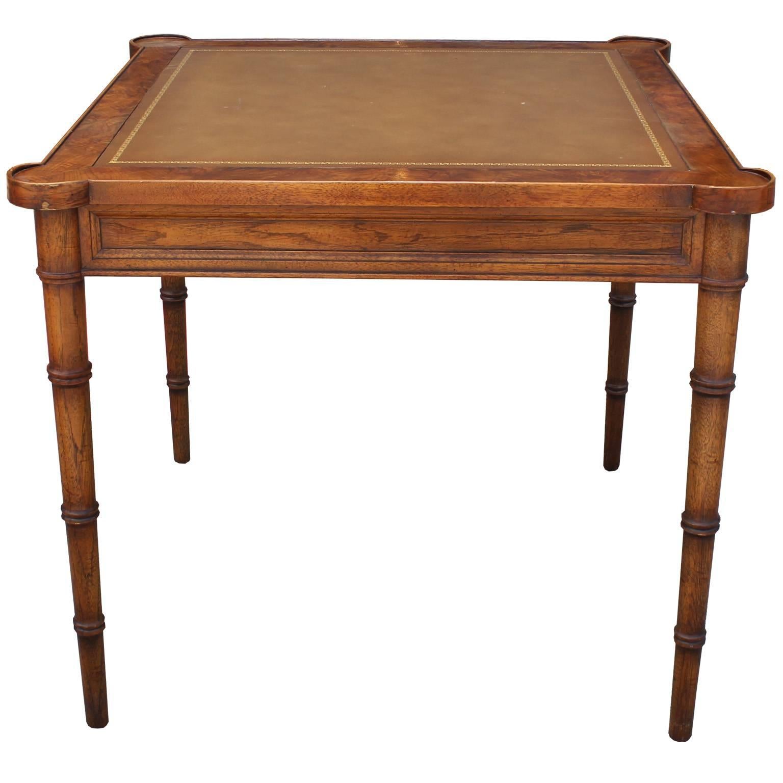 Elegant burl walnut, leather, and faux bamboo square card or game table by Drexel. Table has excellent lines and detailing. Leather top is accented with a gold motif. Table would be excellent in a Hollywood regency, transitional, or Mid-Century