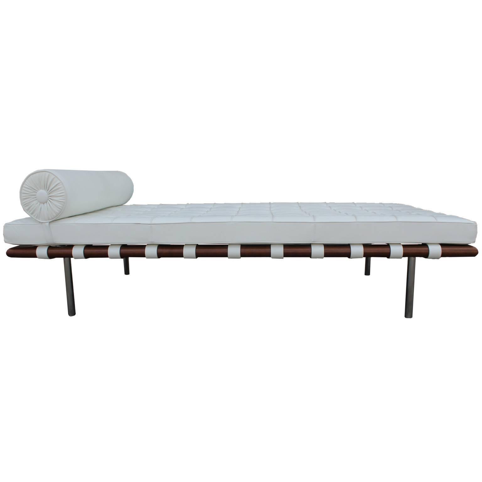 The iconic Barcelona daybed designed by Ludwig Mies van der Rohe and made by Knoll. Daybed is upholstered in a luxe creamy white leather. Leather is in overall good condition. Chrome frames are in excellent shape. Inquire for matching lounge chairs.