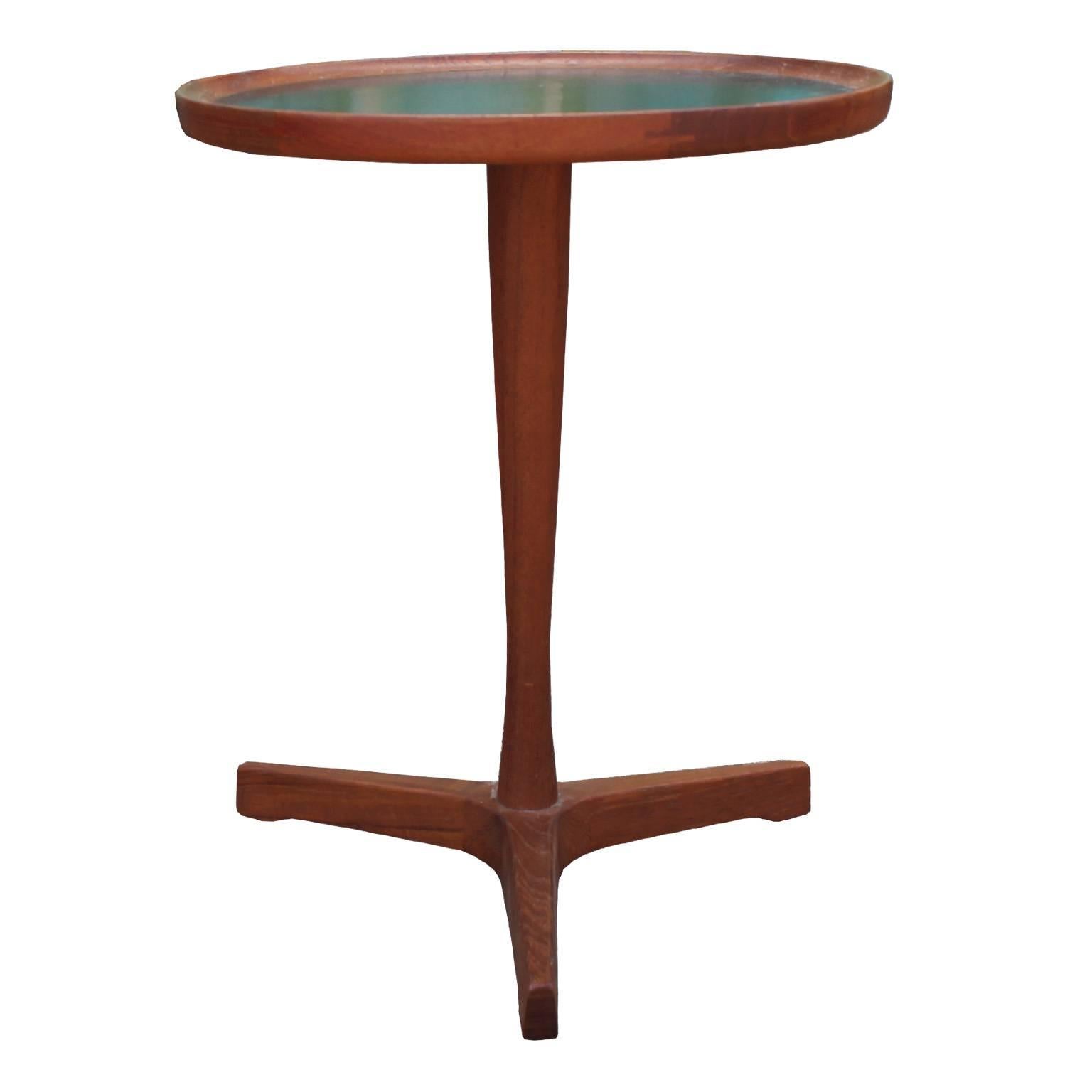 Excellent pair of round side tables by Hans Andersen. Teak Pedestal, tripod base with a black veneered top. Perfect in a Scandinavian, Mid-Century, or Modern interior. In great condition.