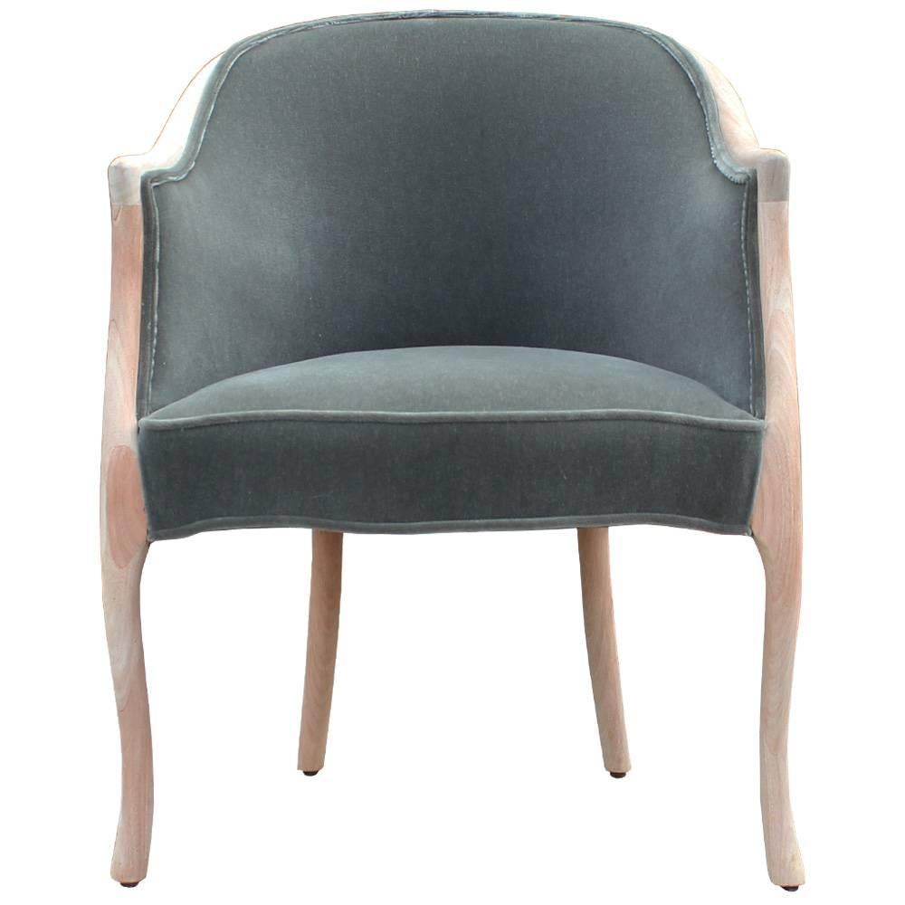Elegant pair of chairs by Baker Furniture Co. Bleached wood frames have beautiful, sculptural lines. Chairs are freshly upholstered in a luxe green grey mohair velvet. Chairs will be perfect in a transitional or Hollywood Regency interior.