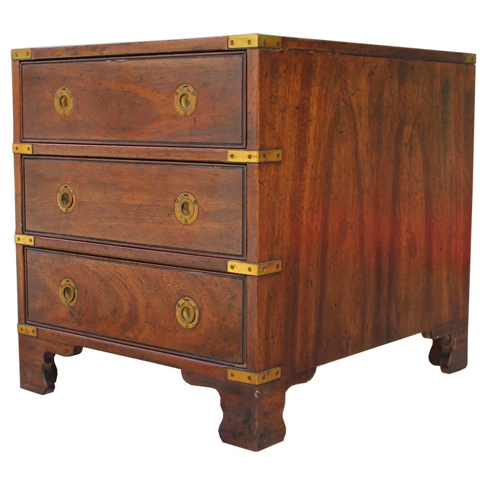 Excellent pair of nightstands or end tables by Heritage Furniture. Tables are outfitted with brass Campaign style hardware. Three drawers provide storage.