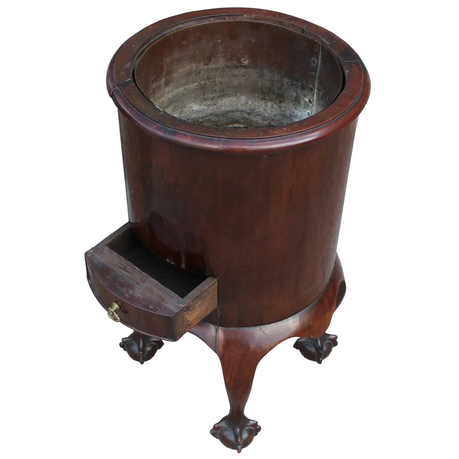 Elegant 18th century wine cooler. English caddy has beautiful lines and craftsmanship with claw and ball feet. A single drawer accented with a brass pull provides storage for wine accessories. Made from a wonder full cut of crotch mahogany.