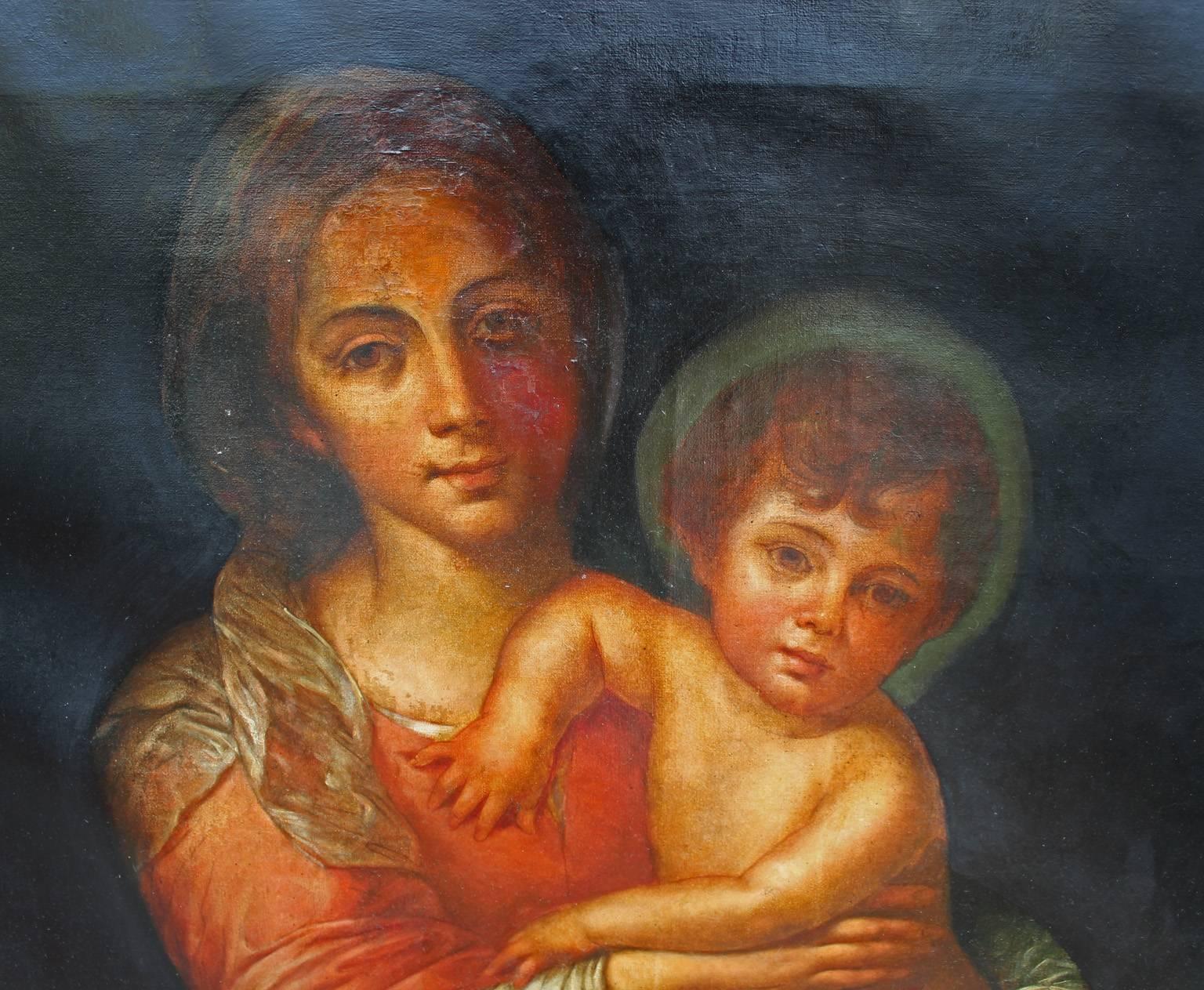 Fabulous 19th century oil painting of Madonna and child. Chiaroscuro painting is very dramatic with bold warm colors. Heavy wonderful ornate frame is gilded and has the perfect patina. There are many numerous repairs and losses.