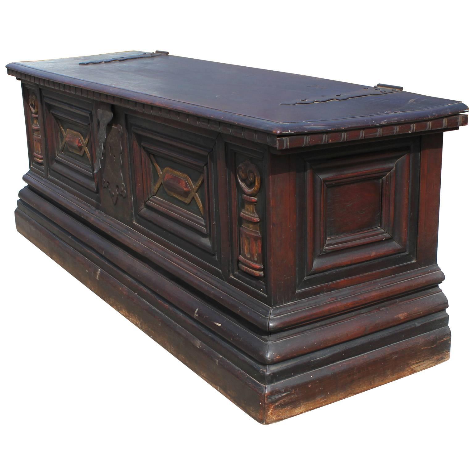 Wonderful, heavy chest. Intricate motif is finished soft washes of color. Black hammered hardware finishes the piece.