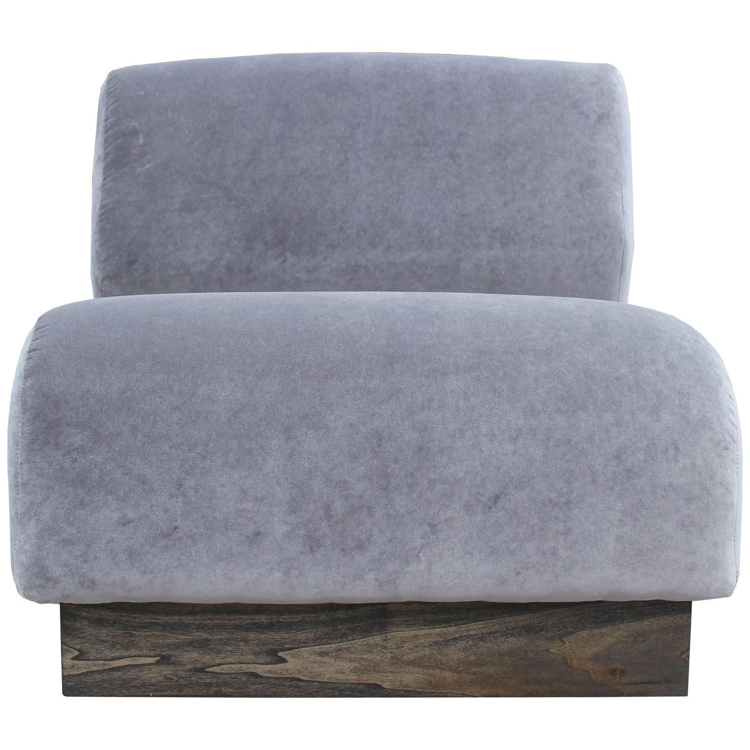 Excellent, modular slipper chair designed by Don Chadwick for Herman Miller. Chair is freshly upholstered in a luxe grey velvet. Charcoal stained custom wooden base.
    