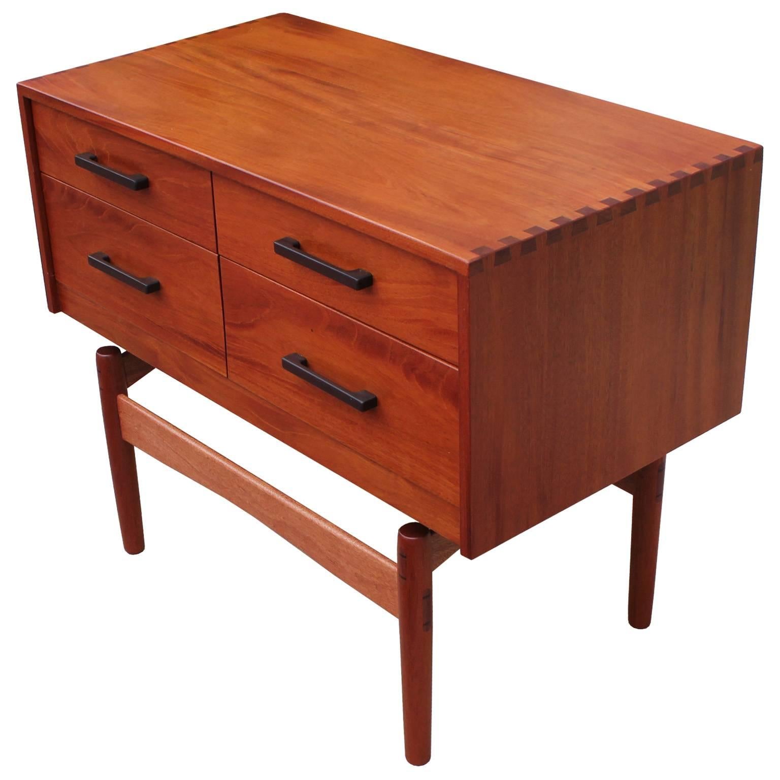 Stunning chest or dresser of excellent craftsmanship by Norm Stoeker. Table has beautiful inlaid detailing and dove tail accents. Four drawers provide storage. Excellent in a Mid-Century, Danish modern, or Scandinavian Modern interior. In the style