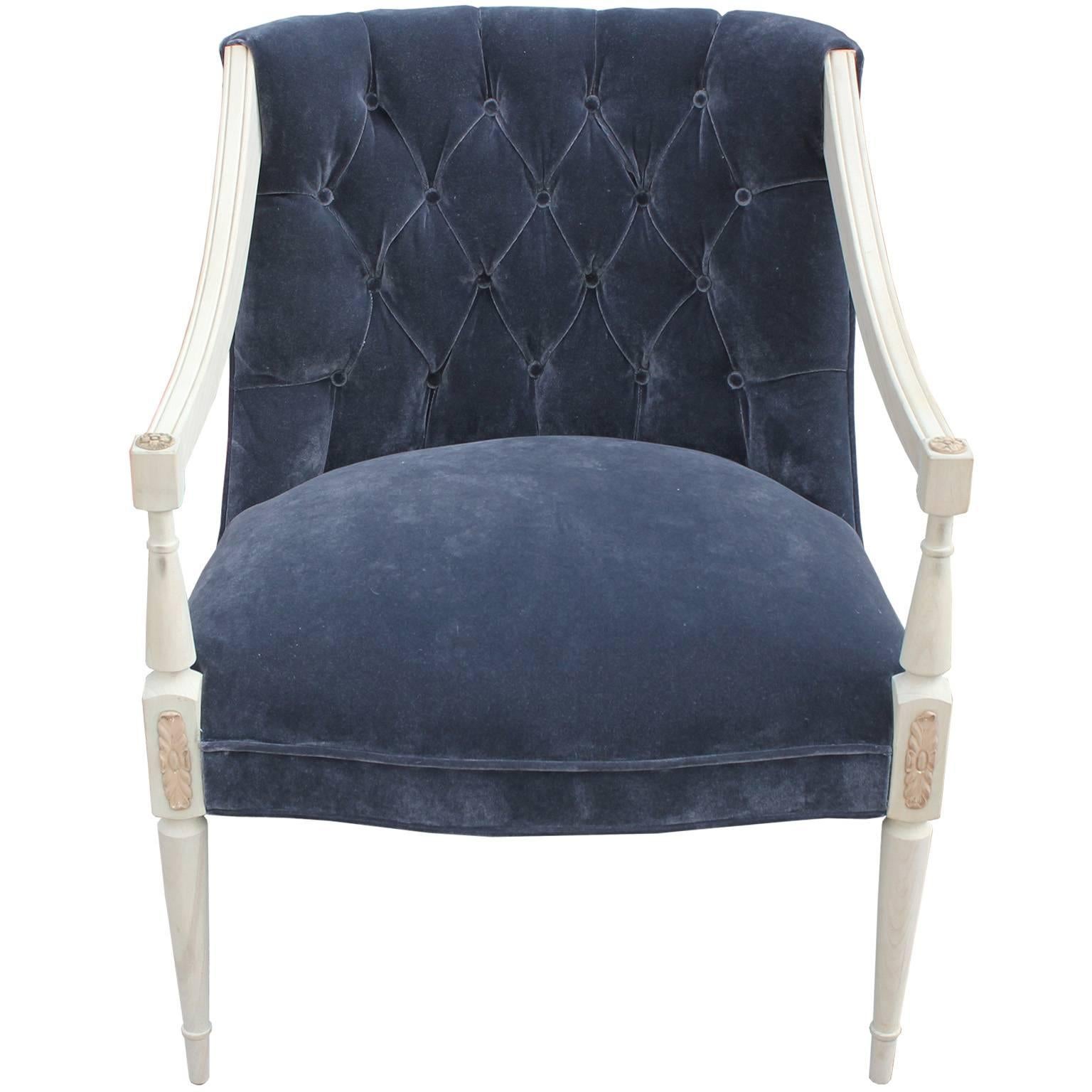 Elegant open-arm French lounge or accent chair. Chair frames has graceful lines with beautiful detailing finished in a pale, bleached wood. Freshly upholstered in a deeply tufted, grey velvet. Perfect in a Hollywood Regency, transitional or