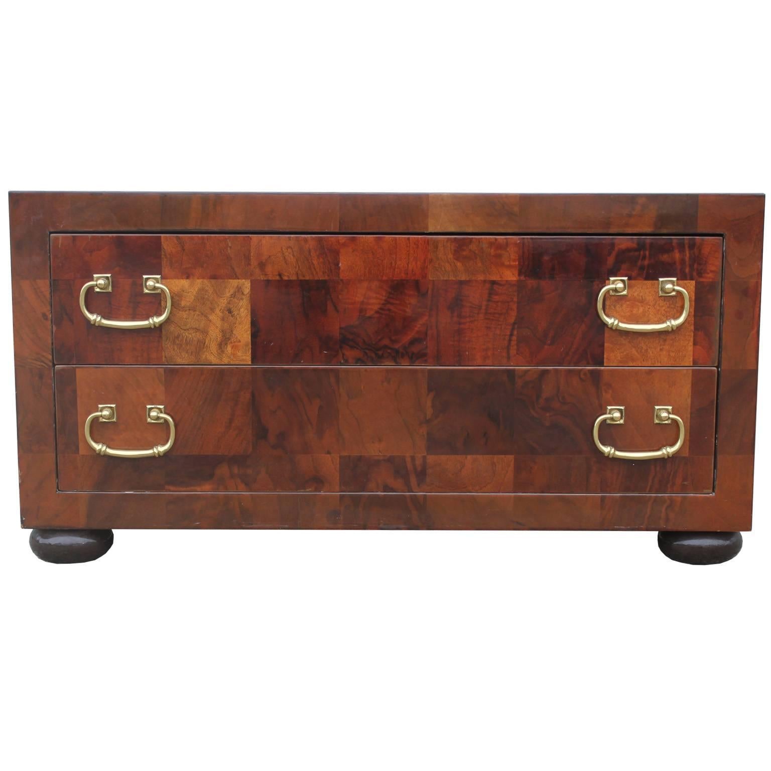 Wonderful two-drawer chest with brass hardware. Chest has a gorgeous parquetry veneer featuring checkers of various tones. Stunning in person. Chest would look beautiful in a Hollywood Regency or transitional interior.