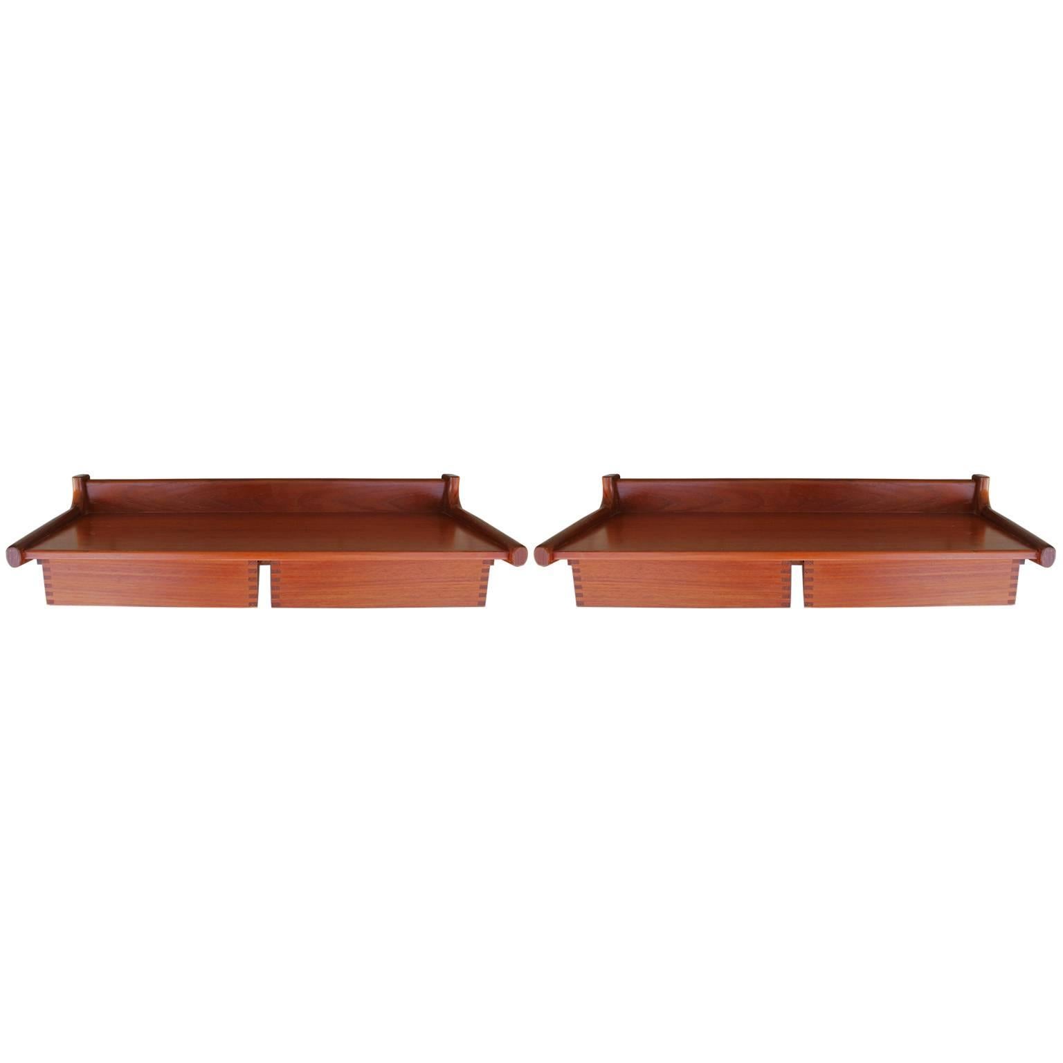 Beautiful pair of teak floating nightstands or shelves attributed to Borge Mogensen. These wall mounted nightstands feature two pull out drawers with delicate finger joints. These easily mount with screws to the back. They would be perfect in a