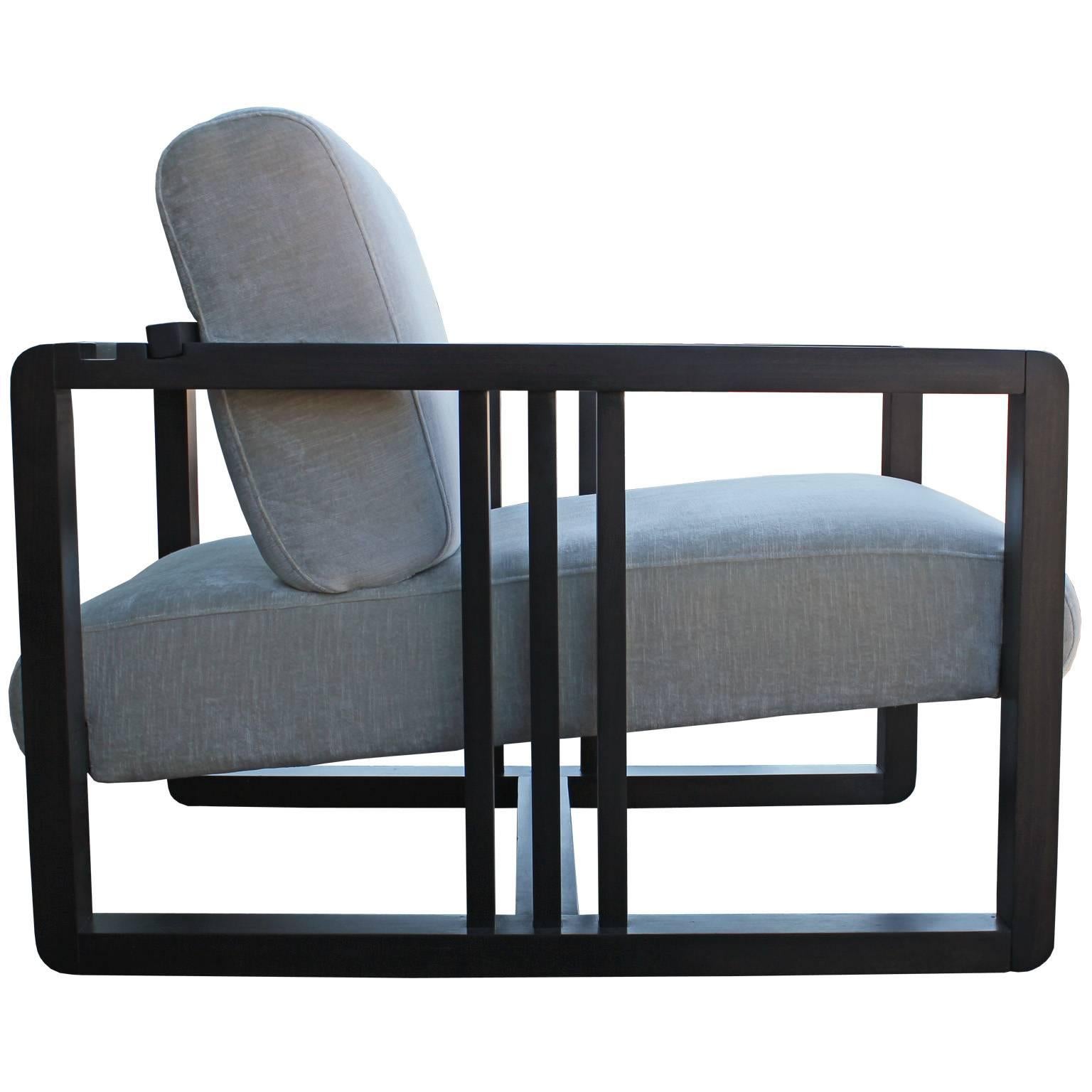 Great pair of Frank Lloyd Wright style adjustable lounge chair manufactured by Roche Bobois. The chairs have been fully restored in a deep ebony finish with a soft supple silver grey velvet. The back are adjustable by moving a slotted bar. These are