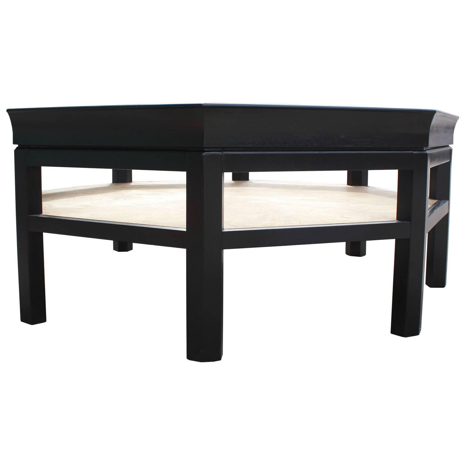 Special edition Baker octagon modern coffee table with a bleached matched grain center. The table has a cleanly finished ebony stain on the rest. It would be great to add some accessories underneath the glass for a unique statement. A great design