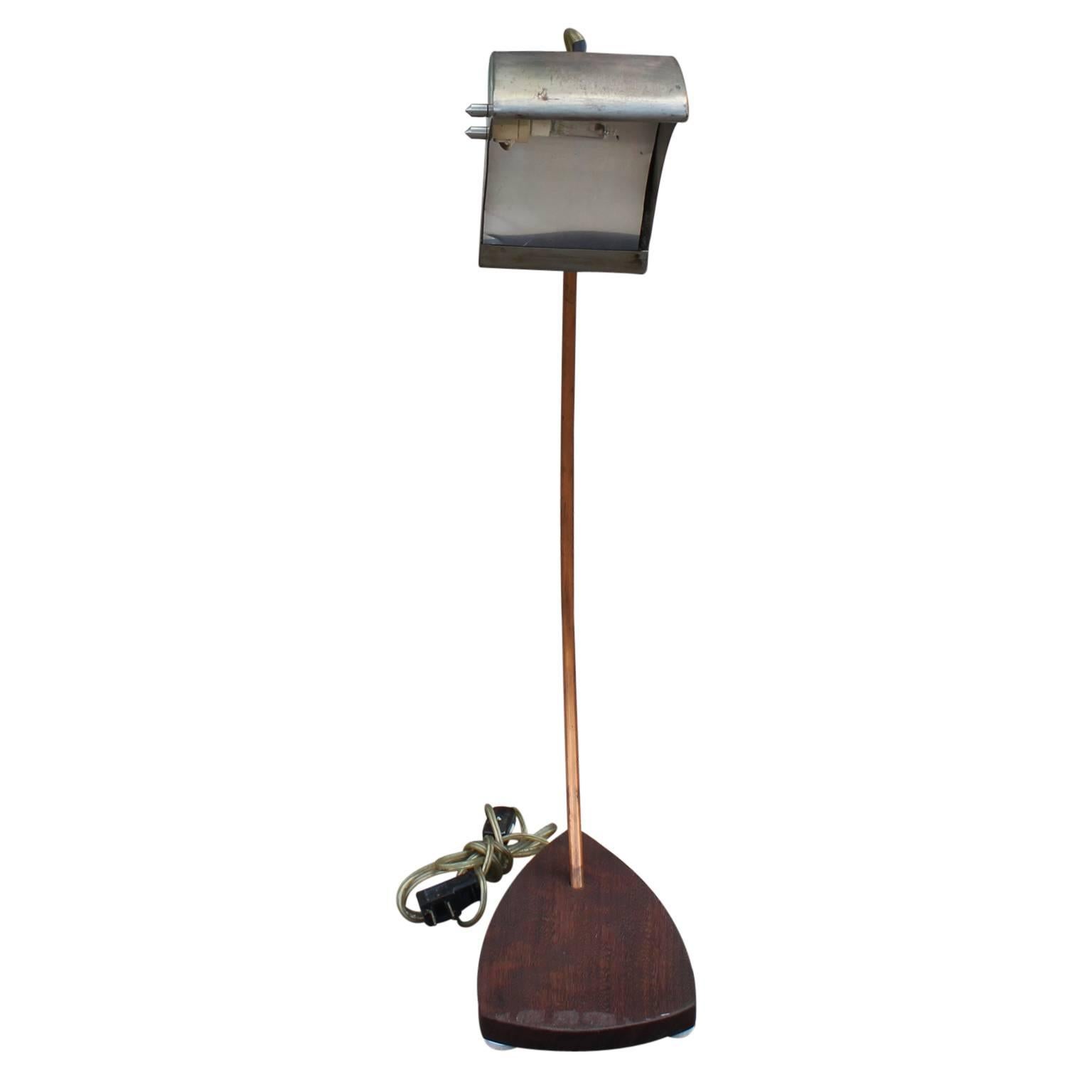 Industrial copper steel and walnut desk lamp.