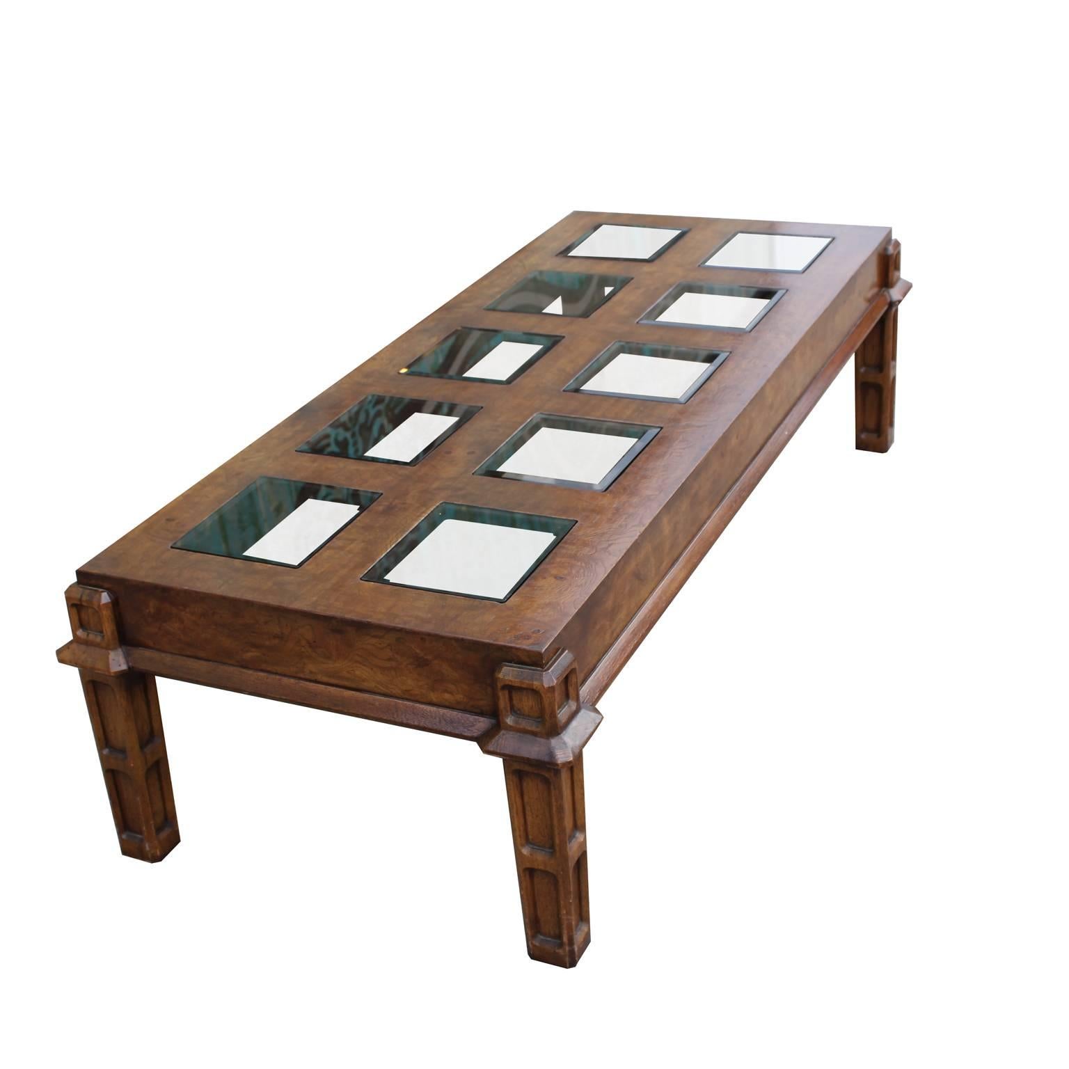 Burl coffee table with square glass inserts.