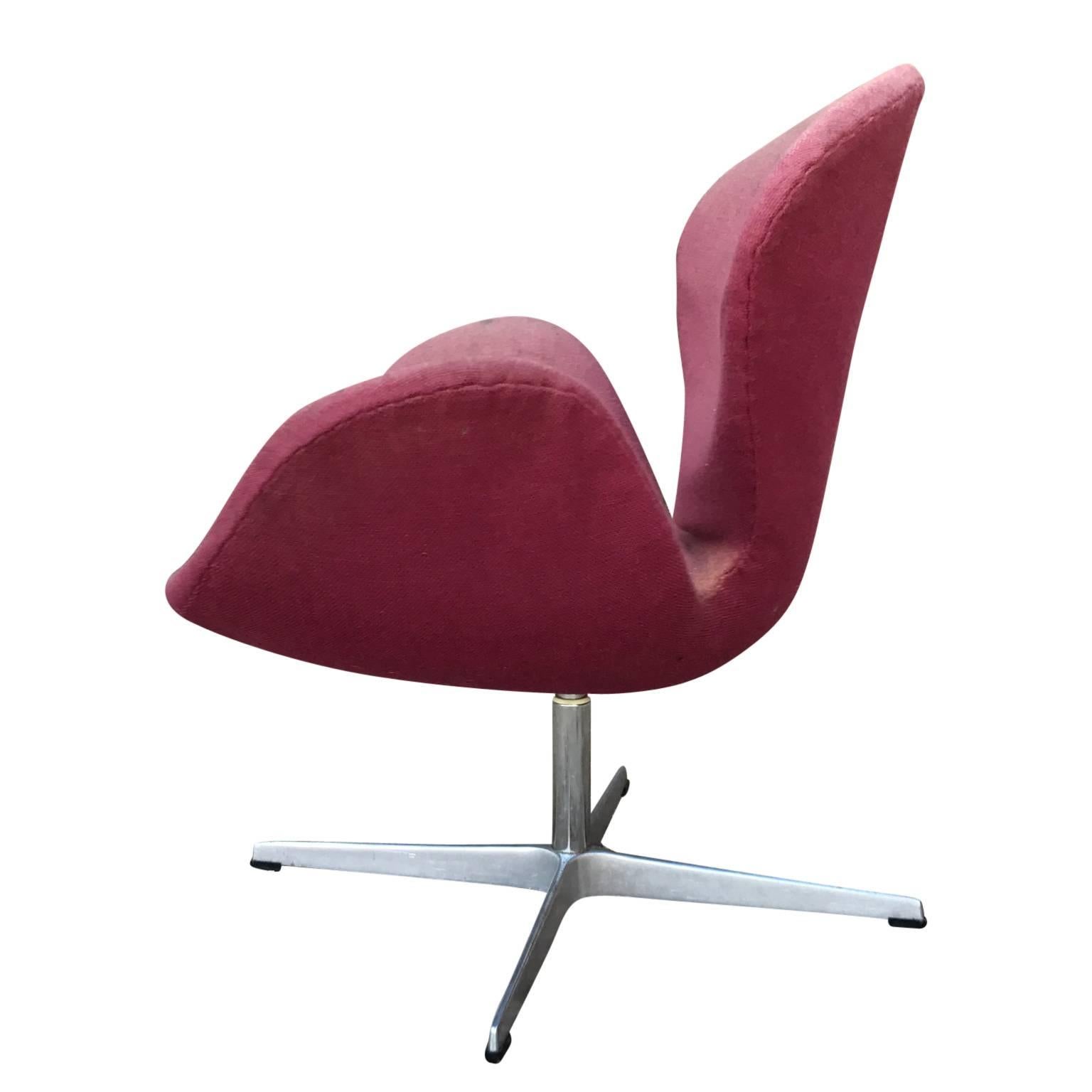 Danish Arne Jacobsen Fritz Hansen swan chair in need of restoration. It retains the original label.