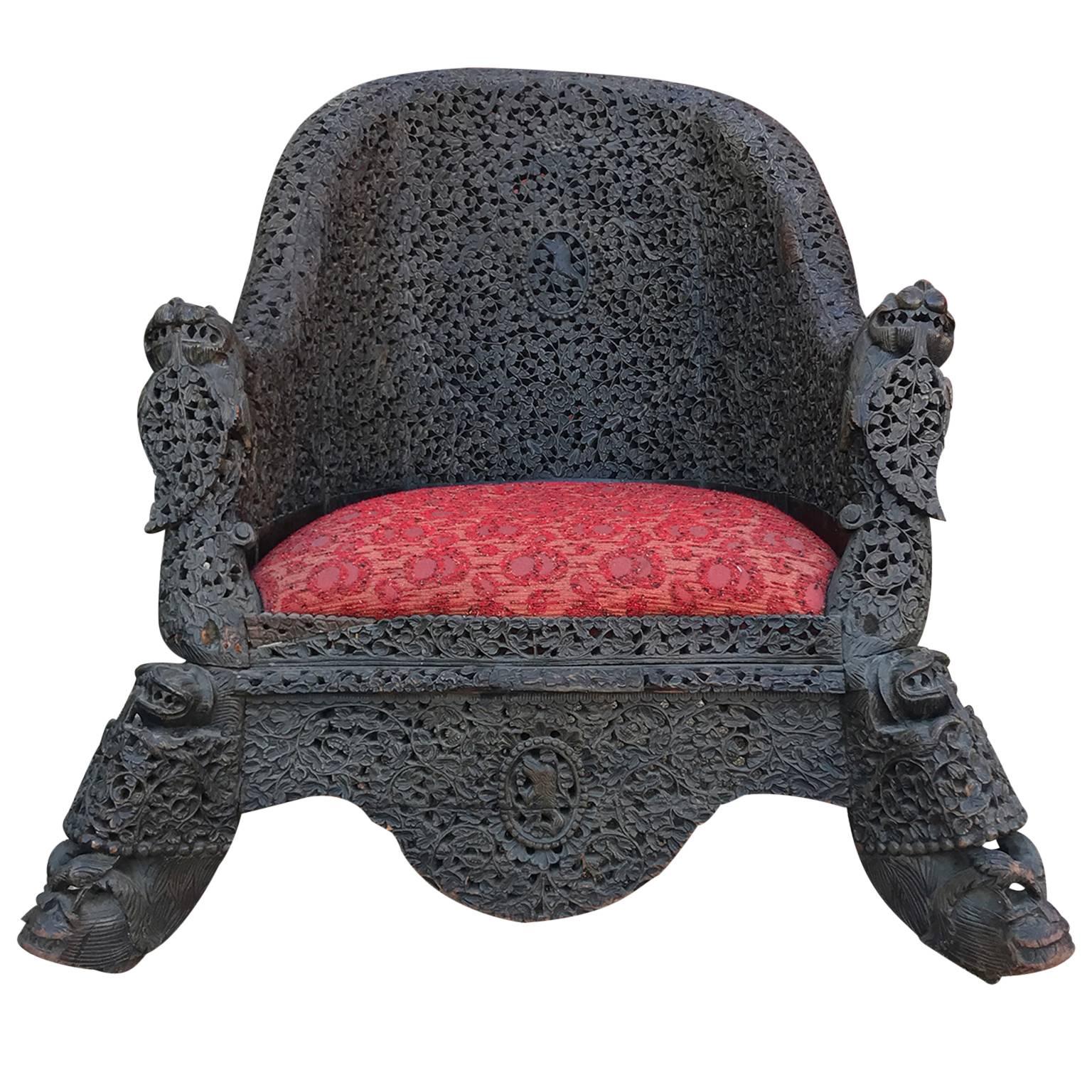 Vintage Heavily Carved Filigreed Burmese Lounge Chair Red Cushion and Iron Wood In Good Condition In Houston, TX