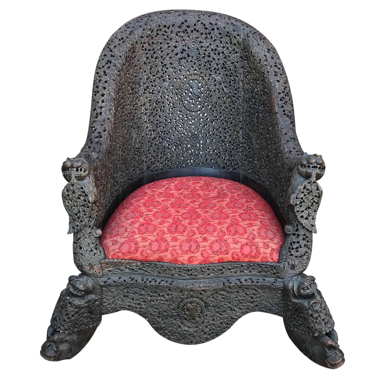 19th Century Vintage Heavily Carved Filigreed Burmese Lounge Chair Red Cushion and Iron Wood