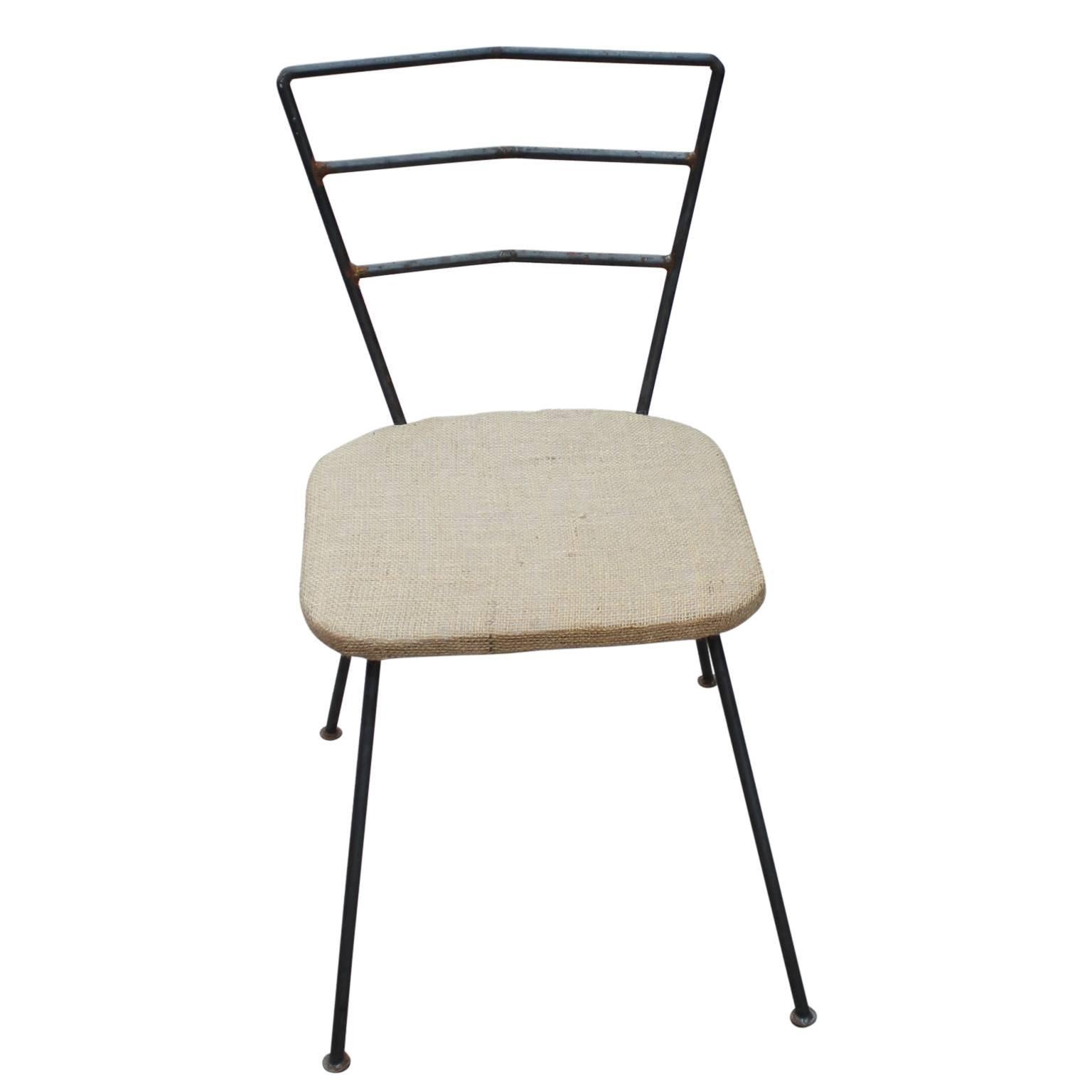 Set of 12 modern iron ladder back dining chairs with canvas seats.