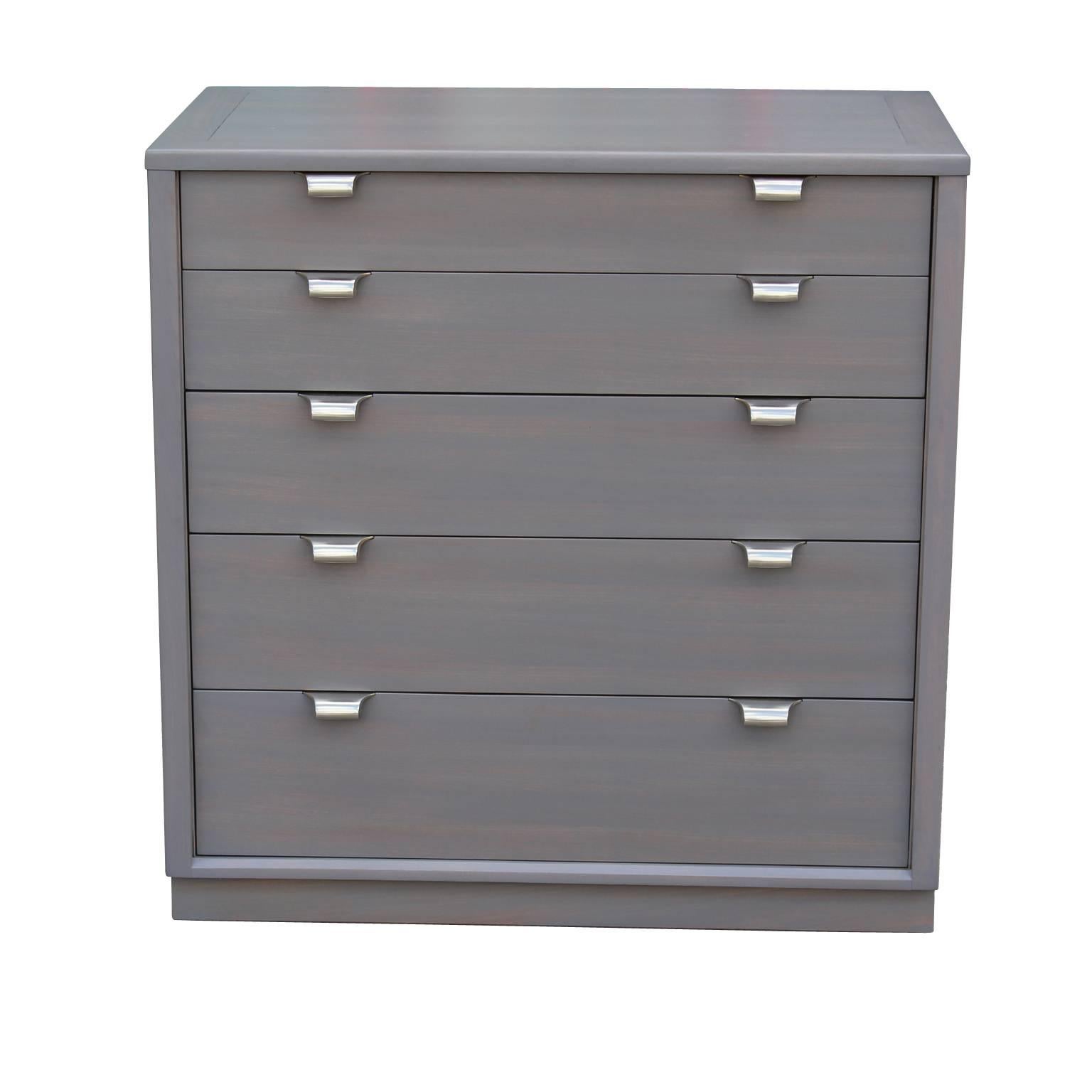 Modern Edward Wormley Drexel five-drawer dresser in grey with blush undertones. This chest has been wonderfully restored in a grey was with shiny chrome handles. Superb craftmanship. 