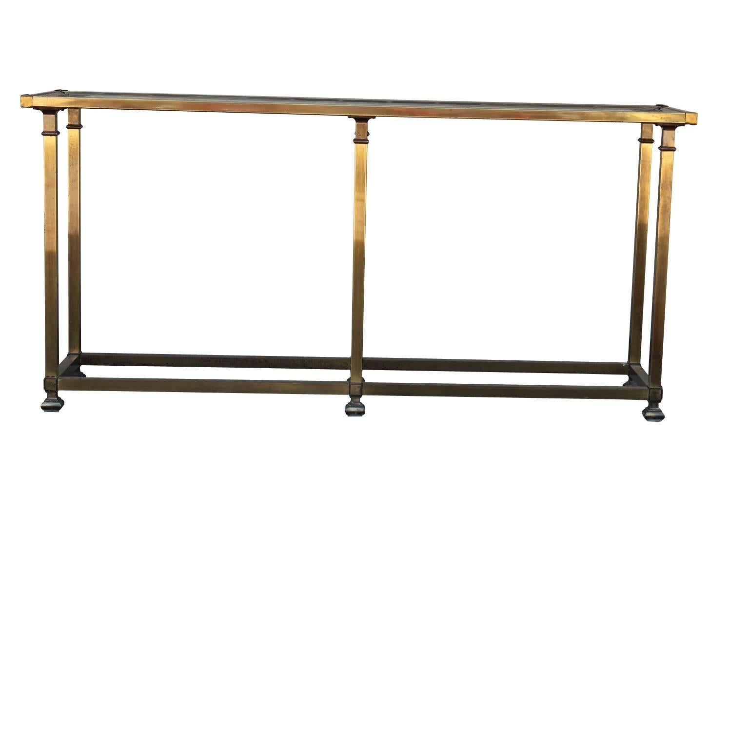 Hollywood Regency Mastercraft console table in brass. The table is in nice vintage condition. There is some wear to the feet, 1970s.