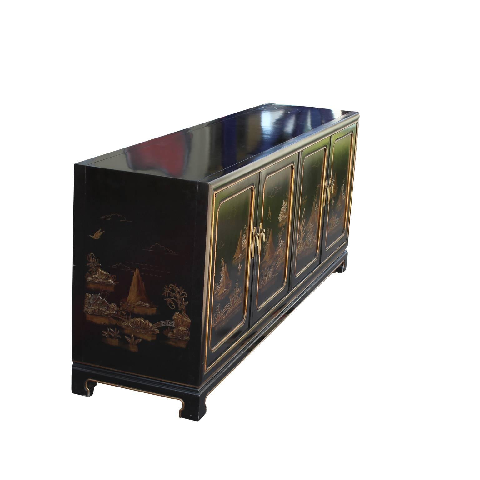 Asian Modern sideboard or cabinet made by John Widdicomb with gold relief art. The sideboard is finished in a faux tortoise or oil drop finish. It is top notch quality and in excellent vintage condition with no major flaws to note.