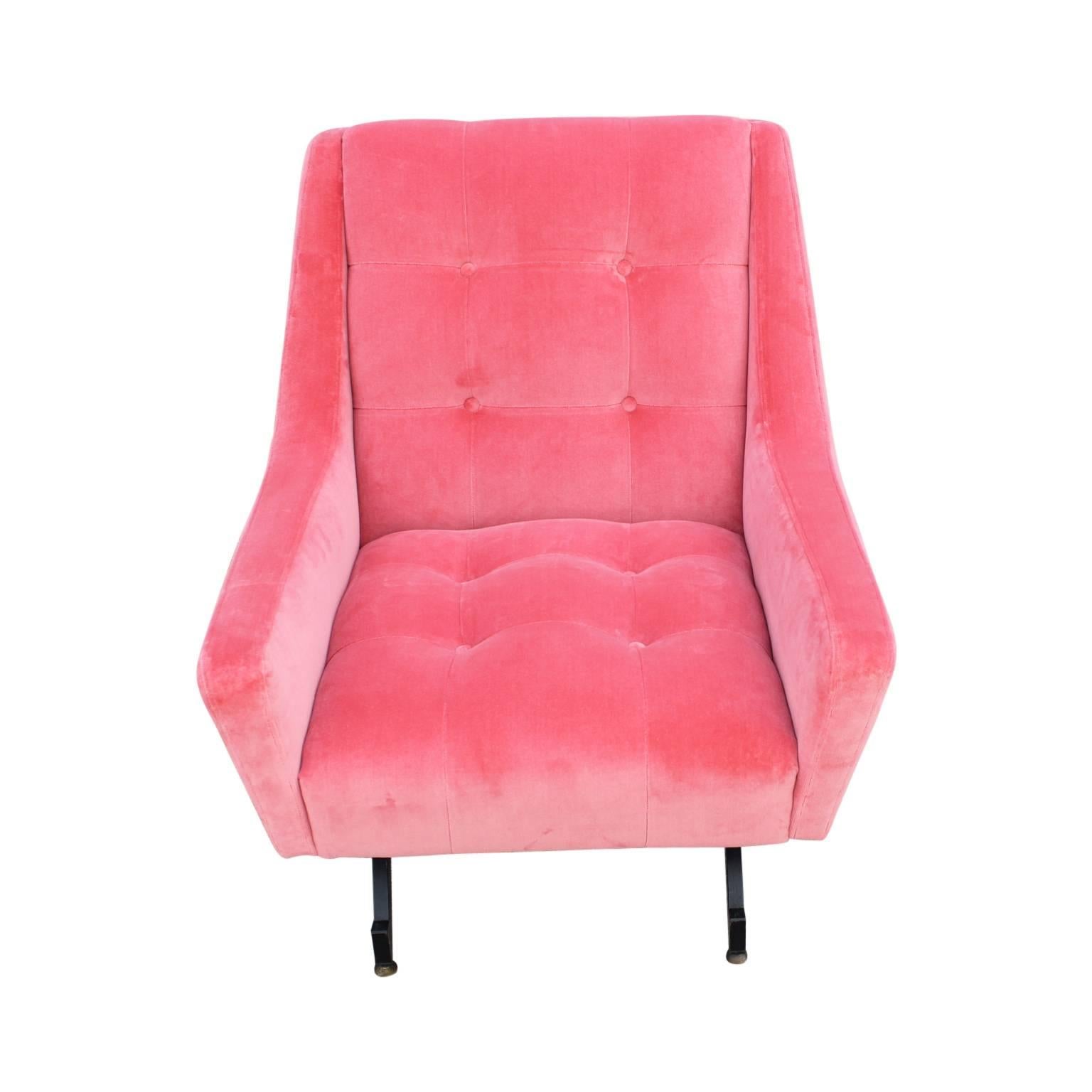Gorgeous pair of lounge chairs recently reupholstered in coral pink velvet with adjustable legs. Wonderful statement pieces.