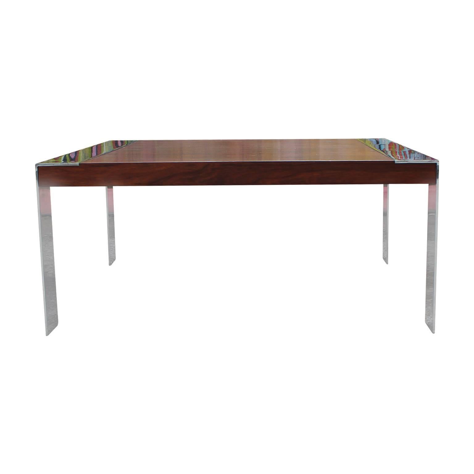 Gorgeous square coffee table featuring chrome legs and a rosewood top in the style of Milo Baughman circa 1970s. The chrome is heavy and shiny. In excellent vintage condition.