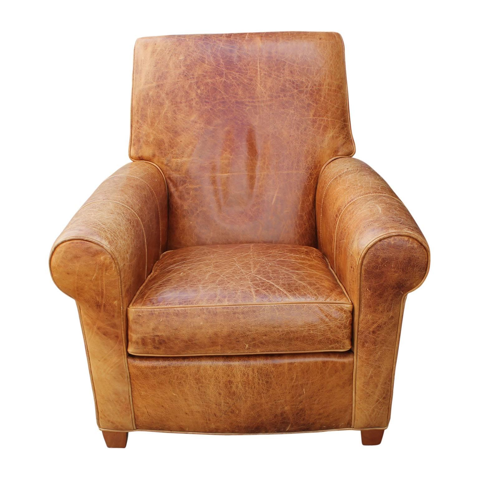 light brown leather chair with ottoman