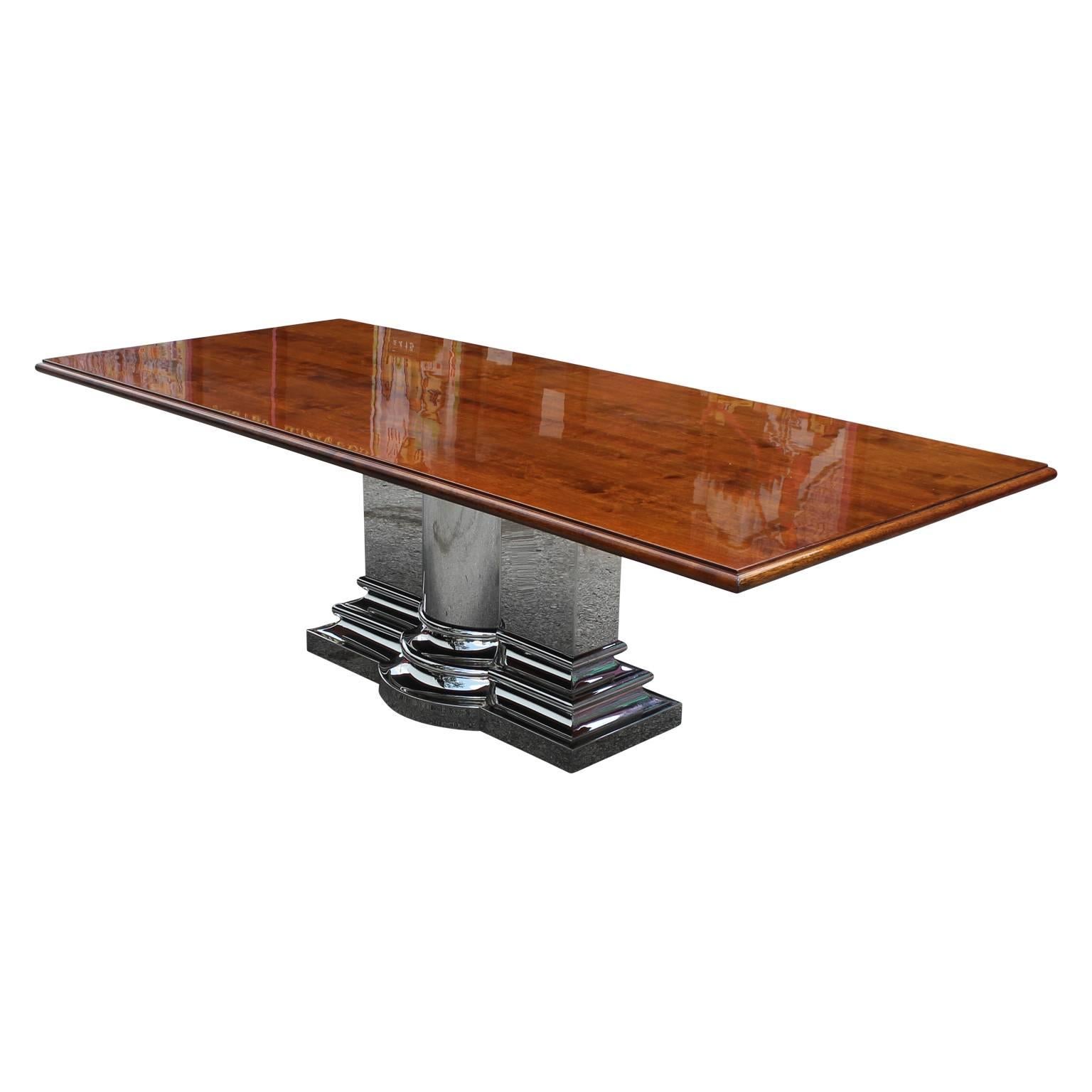 Large monumental walnut dining or conference table with a unique and elegant stainless steel base base designed by Stanley Jay Friedman for Brueton. Superb quality. The table can accommodate a larger heavier top as well.


