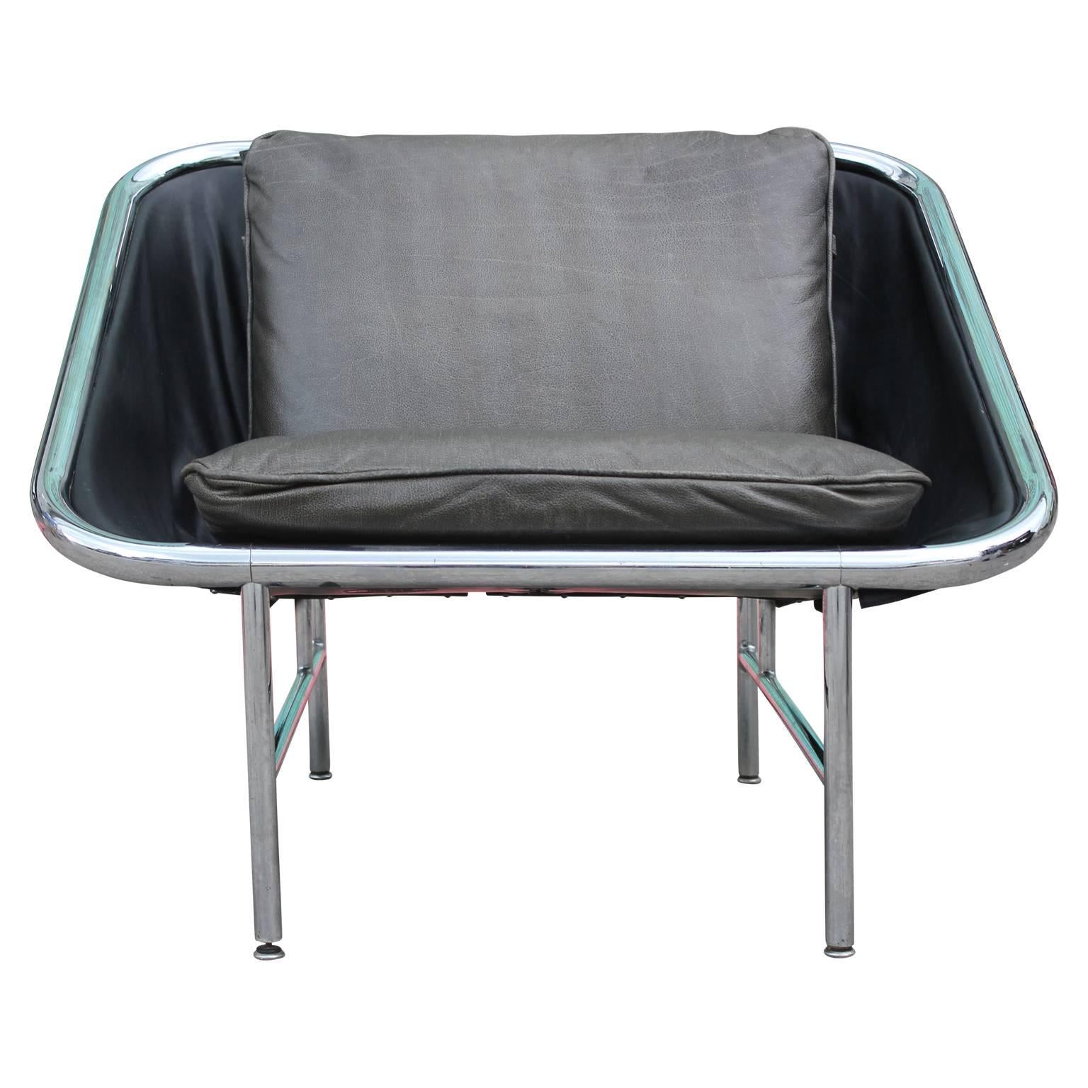 Unique George Nelson for Herman Miller chair made of chrome and custom made cushions in water buffalo leather. There are optional triangular arm pillows available, as seen in the last photo. Extremely sleek and a perfect addition to any room!