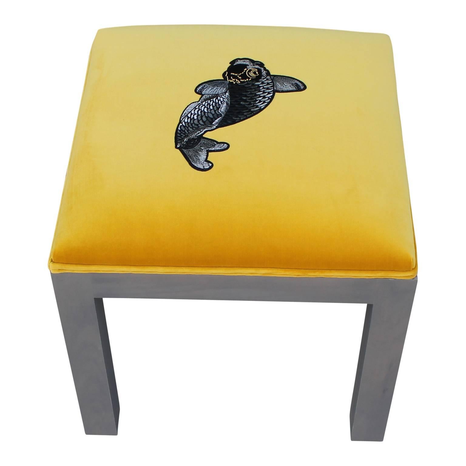 Luxe modern pair of custom-made deep yellow Kravet velvet ottomans with detailed applied Koi embroidery. A grey stain overlay on simplistic legs. Style from either Parsons School of Art and Design or Milo Baughman. We can custom make these for you