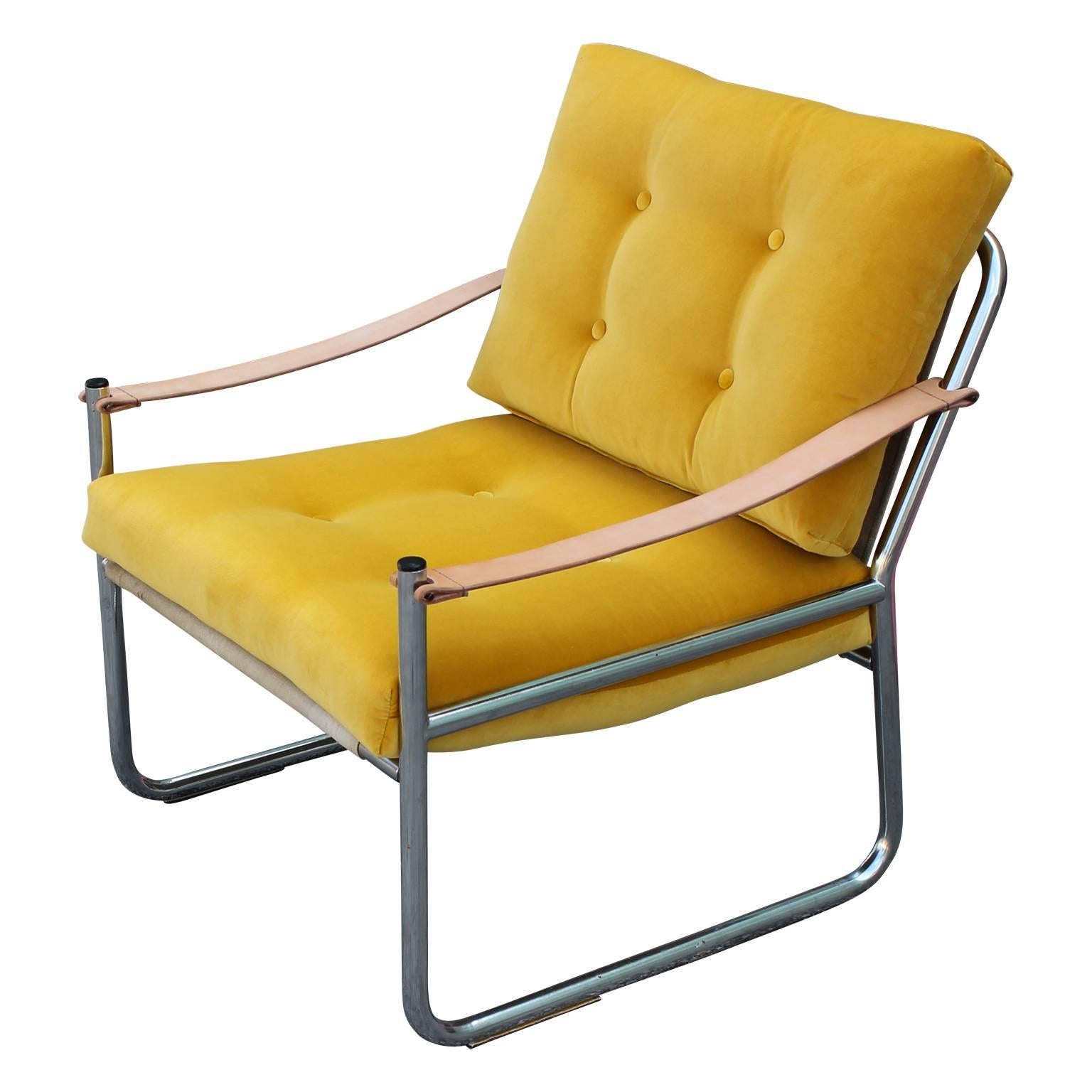Unique pair of safari style Danish lounge chairs with a thick tubular chrome-plated frame, that we had upholstered in a rich yellow Kravet velvet. New leather straps as the arm rests as well. The canvas is original and in nice condition with very