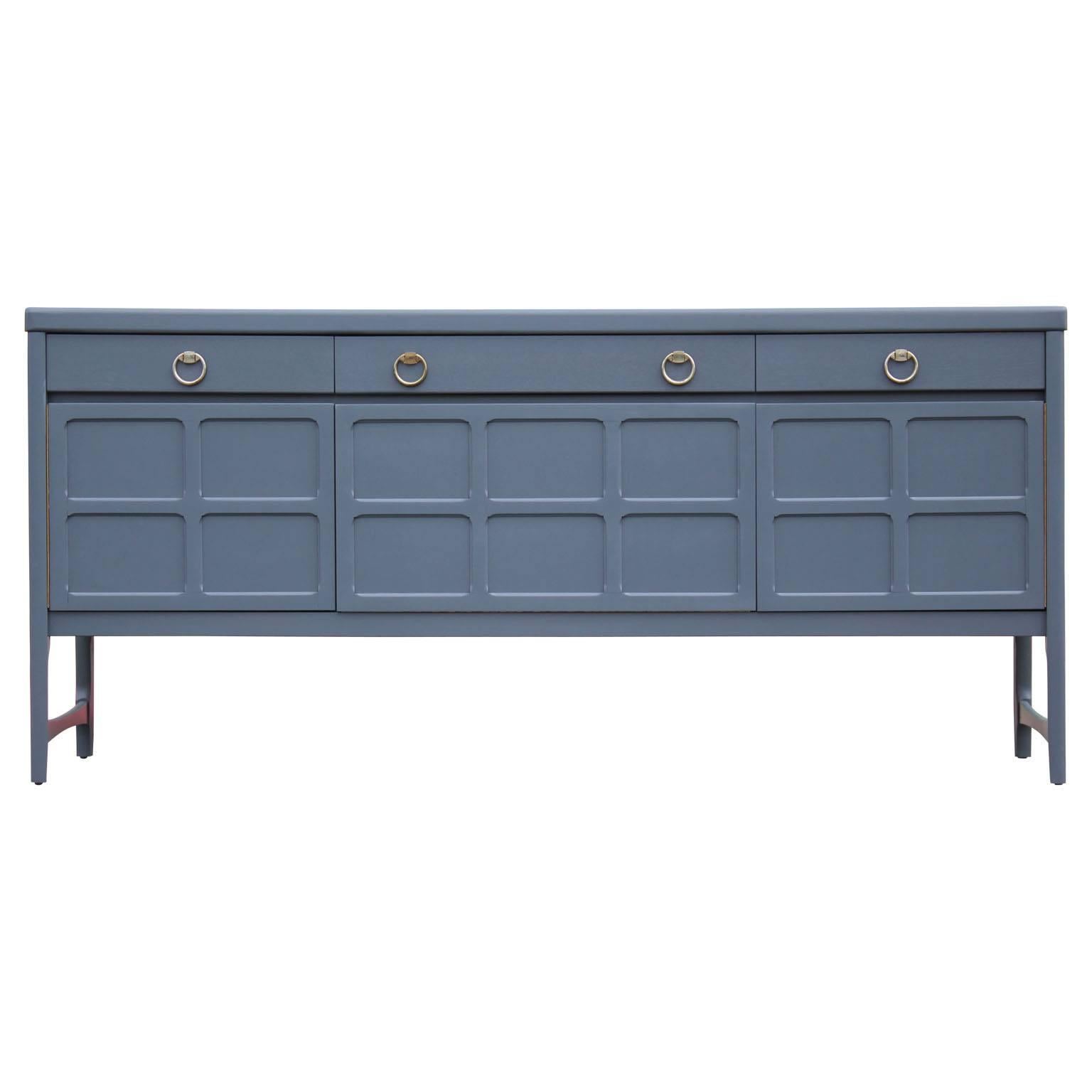 Gorgeous Hollywood Regency style credenza or sideboard freshly stained in a deep blue or grey with brass patinated pulls. Perfect statement piece to any room.