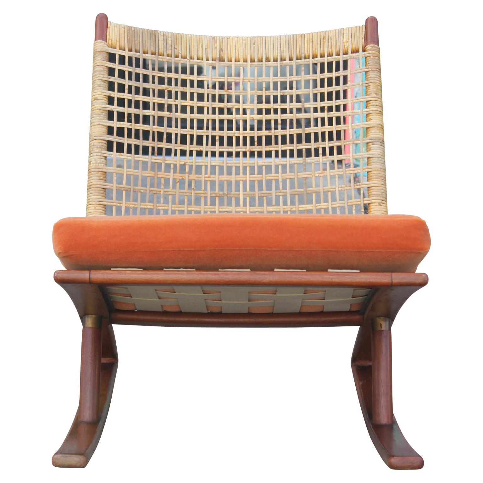 Mid-Century Modern teak rocking chair by Fredrik Kayser with a cane back and leather strapping for the seat. 