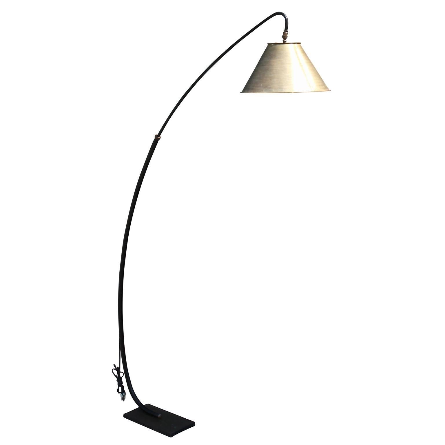 Wonderful mid-century floor lamp. Lamp is arched forward, perfect for reading. Base is a black metal and shade is faux finished with a bronze look.
