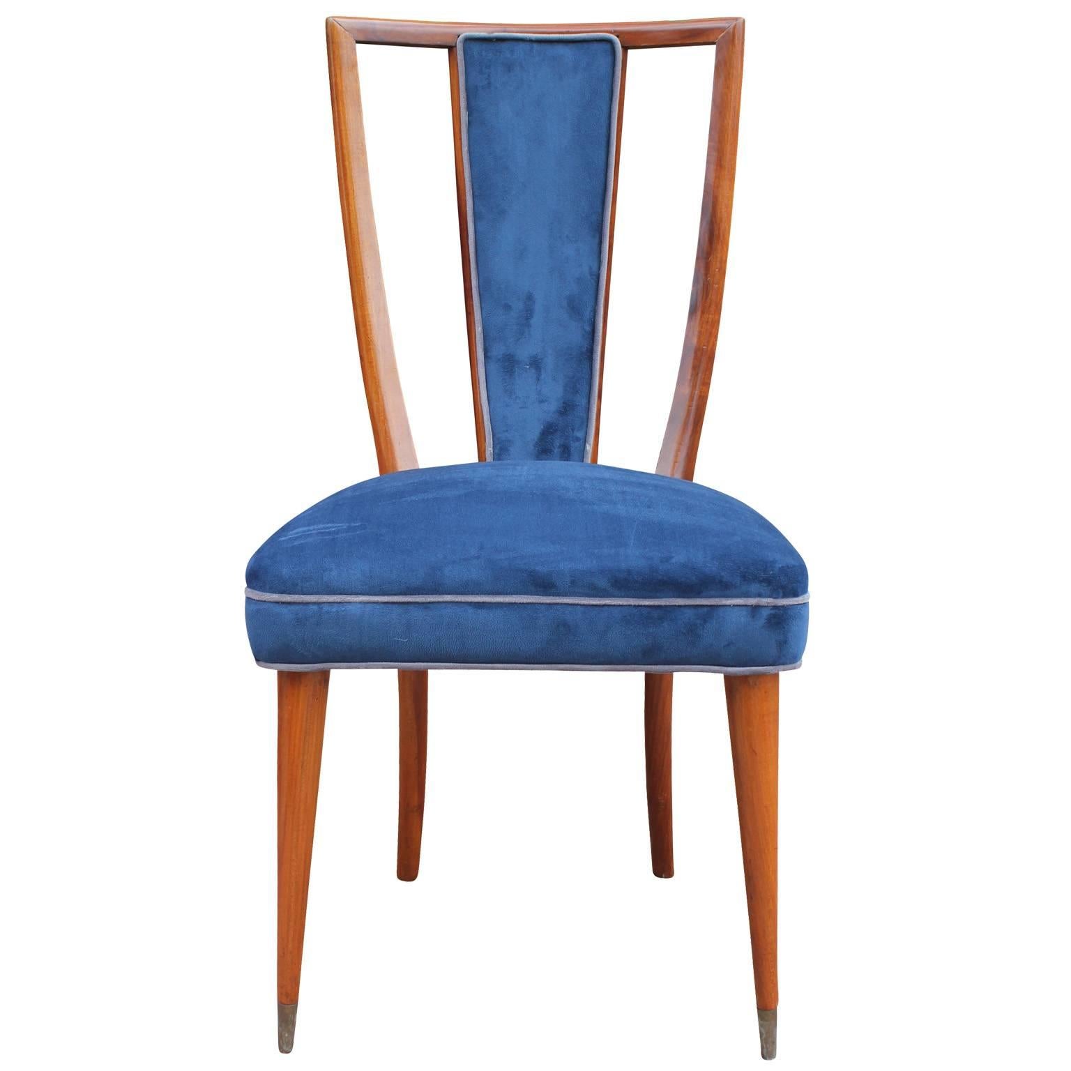 Wonderful set of 6 high backed dining chairs. Medium walnut colored frames have elegant lines and lovely negative space. Chairs are currently upholstered in a blue velvet which could use updating. We believe the chairs are French or Italian. One