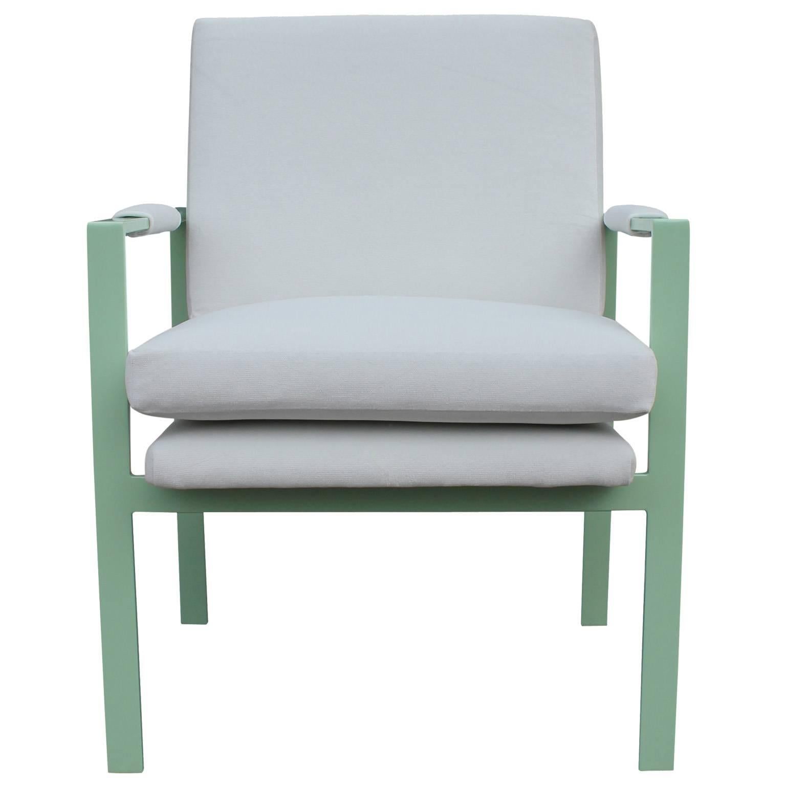 Stunning pair of lounge chairs. Clean lined, steel flat bar frame is finished in a mint green powder coat. Chairs are freshly upholstered in a marshmallow white velvet. Chairs have wonderful negative space and look incredible from every angle. 