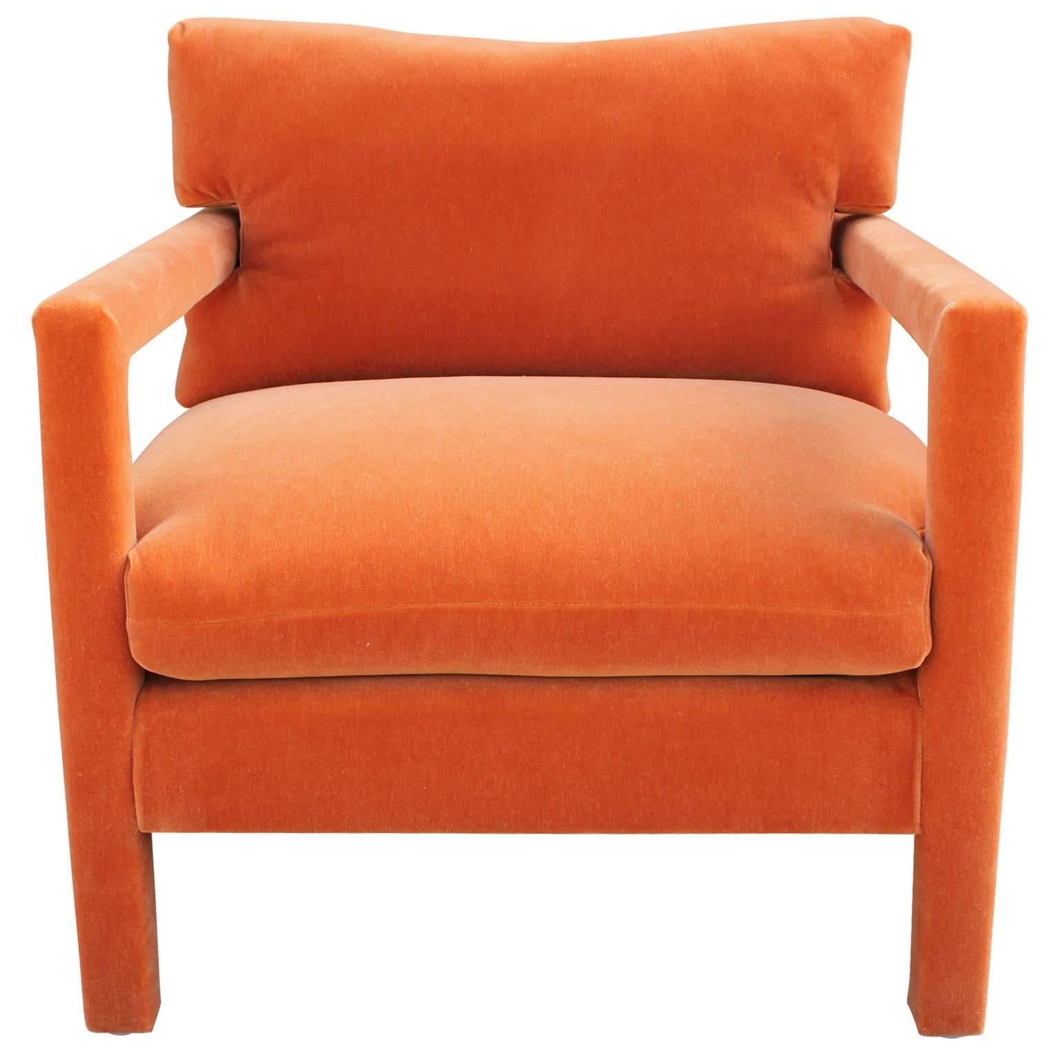 Beautiful pair of Parson style lounge chairs attributed Milo Baughman. Chairs are freshly upholstered in melon orange mohair velvet. 